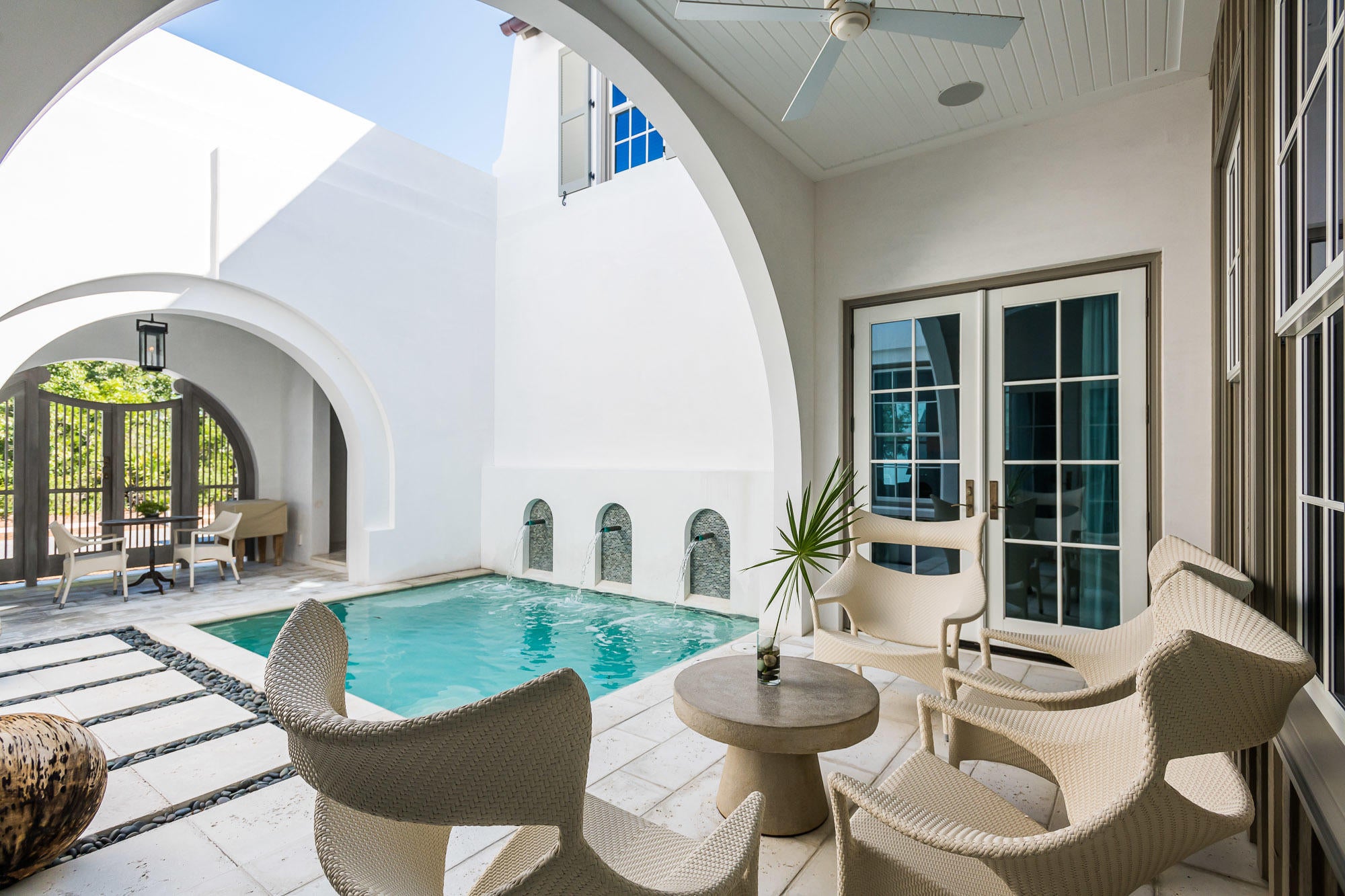 Eric Watson P.A. Architecture delivers Alys Beach lifestyle at its finest in this 3,013 square foot design. Ideally located on a corner homesite reveals the one of a kind architecture showcasing the beautiful elevations of the home. This custom home personifies the Bermudan, Antiguan, and Guatemalan design influence Alys Beach has captured. This stunning home is strategically nestled steps away from the emerging Town Center, Caliza Pool & Restaurant, and the 15,000 square foot Zuma Fitness Center which recently opened. Placement of this stunning home is kept within the heart of Alys Beach. Entertaining & livability is not questioned with this property. The private owners Beach Club is now under construction scheduled to open late Fall 2020. The home allows for full-time residency with the generous living aspects the home offers both indoors & out. This 4 bedroom property plus bunk room hosts 4 full bathrooms plus a powder room. Custom interior wood doors hand crafted by E. F. San Juan are seamlessly set into the walls of Venetian Plaster from floor to ceiling.

The home's 4 bedrooms provide one guest master suite on the 1st floor having the main master suite on the 2nd floor. The 1st floor master suite opens to views of the lush courtyard & pool with the 2nd floor main master having north & south windows carrying natural light throughout. Each of the master suites provide dual vanities with the main master suite having a soaking tub with a separate shower.

The 1st floor carries Rice White Peacock Paver flooring throughout which continues to the courtyard surrounding the pool. The 2nd level floors are warmed by natural White Oak throughout transitioning to the various stone floors of the bathrooms. All rooms of the home receive cascading natural light.

Saving the best for last is the magnificent kitchen, dining, and living area open to all. This space is occupied with tall ceilings hosting gorgeous double hung windows running opposite of each other allowing for amazing transitional light. The northern window wall looks upon the lush courtyard and its pool. The gourmet kitchen surrounds the home's large Butcher Block island with sink and dishwasher which look through to the dining & living rooms back dropped by a fireplace. Stainless Sub Zero & Wolf appliances add to the homes clean, modern lines.