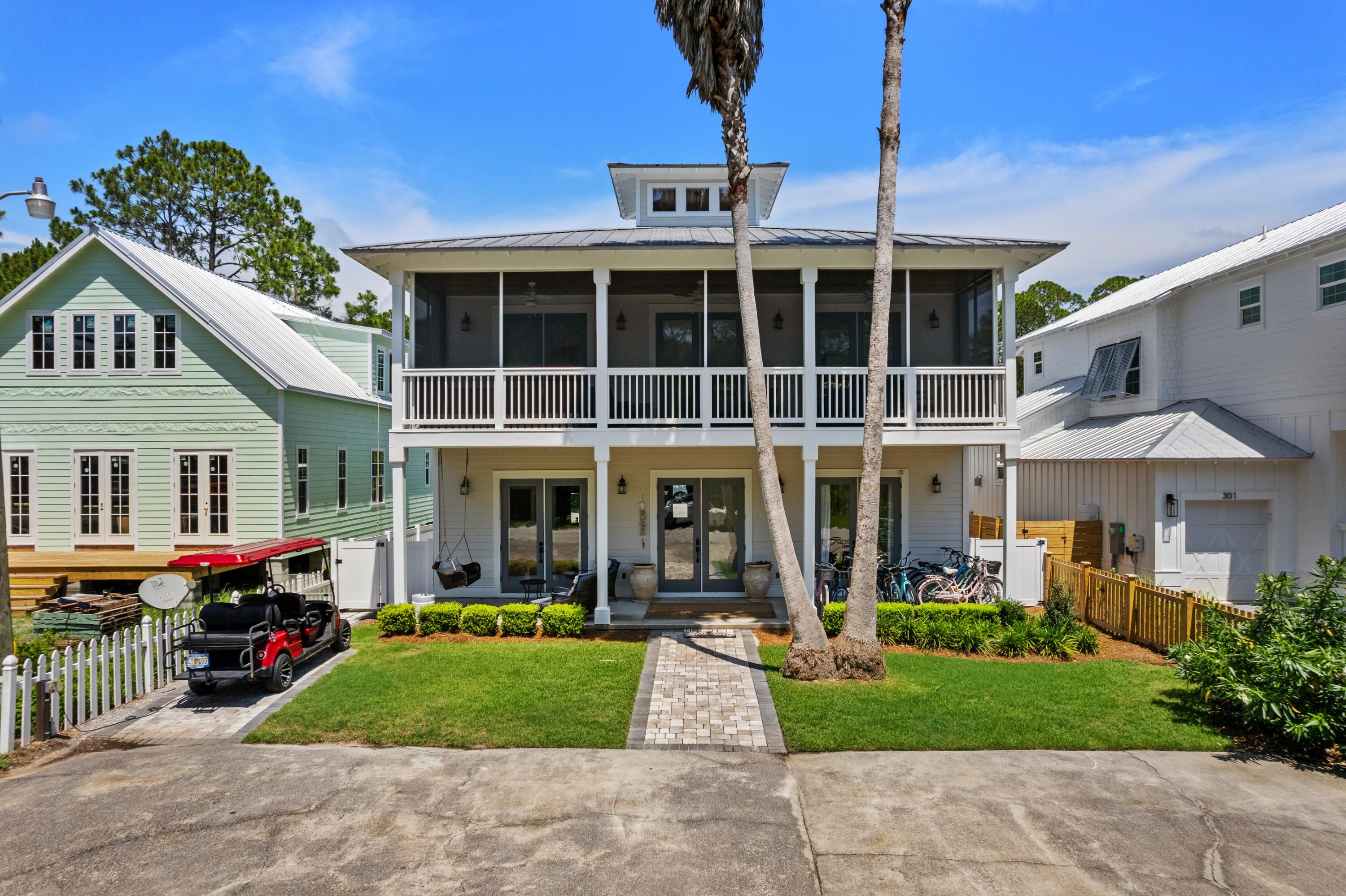 With guaranteed rental income and below-market financing, this property is undoubtedly one of the best investment opportunities along 30A. The projected income is $233k-$288k and the seller guarantees a minimum of $180,000 in rental income for 2025! Plus the seller is offering a special financing incentive at 5.5% APR on a 30-year fixed-rate mortgage for qualified buyers.  The home, outdoor amenities and furnishings are nearly all new or recently remodeled making this the ultimate turn-key luxury second home or short term rental investment.
Prime Location with deeded beach access! Nestled in the coveted Gulf Shore Manor neighborhood of Seagrove in close proximity to Seaside, this property offers the largest expanse of both deeded and public beach access with parking along 30A.  Guests will love the easy walking or biking distance to Seaside. With recent concerns about private beach restrictions, Gulf Shore Manor is protected by their court awarded deeded beach use rights. Another bonus is no HOA dues or HOA restrictions. The nearest beach access with parking, San Juan, is just four blocks away. Guests also enjoy the included golf cart and a dozen bikes for effortless transportation of beach gear.
Parking is often a challenge in vacation rentals, but this property accommodates five vehicles plus a golf cart, making it highly desirable! With a main house and a guest house, both featuring full kitchens and living areas, this home is perfect for multiple families vacationing together, family reunions, corporate retreats, and groups of friends.  And with a sleeping capacity of 21+ people it commands a premium nightly rate.
Outdoor amenities: The private heated pool, spa, gas grill, private dining patio, and fully screened upper porch are popular outdoor amenities. 

Recently remodeled: The entire guest house, landscaping, pool, and master bathroom have all been expertly installed or remodeled by the current owners within the last few years with the balance of the main house remodeled recently as well.  The entire exterior was just painted so the new owners can immediately enjoy making memories in this amazing beach home while your short term renters pay the bill.
Elegant Design and Layout: The main house boasts a gorgeous kitchen with timeless bespoke shaker style cabinetry, dining area, great room, screened porch, and master bath on the upper level. The great room features vaulted ceilings with tongue-and-groove details. The master bathroom was remodeled in spring 2024 with a luxury carrara marble shower as the centerpiece. The main floor includes two private bedrooms with ensuite baths, a large bunk room with two sets of queen-over-queen bunks and trundle (sleeping 10), another hallway bathroom, and a kids' game room with video games, a sofa, TV, and built-in twin bunks.
The guest house features another living area, full kitchen, mini bunk with twin over twin bunks, a full bathroom, queen bedroom, and a master suite with full bathroom.  The guest room was completely remodeled top to bottom in 2021.  Be sure and view the Matterport virtual tour and floorplans.

This stunning, fully furnished property includes a professionally designed website at elmbythesea.com for direct bookings, in addition to listings on Airbnb, VRBO, and more. High cash flow and beautiful included furnishings make it an irresistible investment.
Don't miss this unparalleled coastal paradise! Embrace the essence of luxury, convenience, and extraordinary investment potential in your own dream oasis. Act now and secure your place in one of 30A's most desired communities. Seller is flexible on closing dates...a delayed closing to coincide with a future 1031 sale is fine
