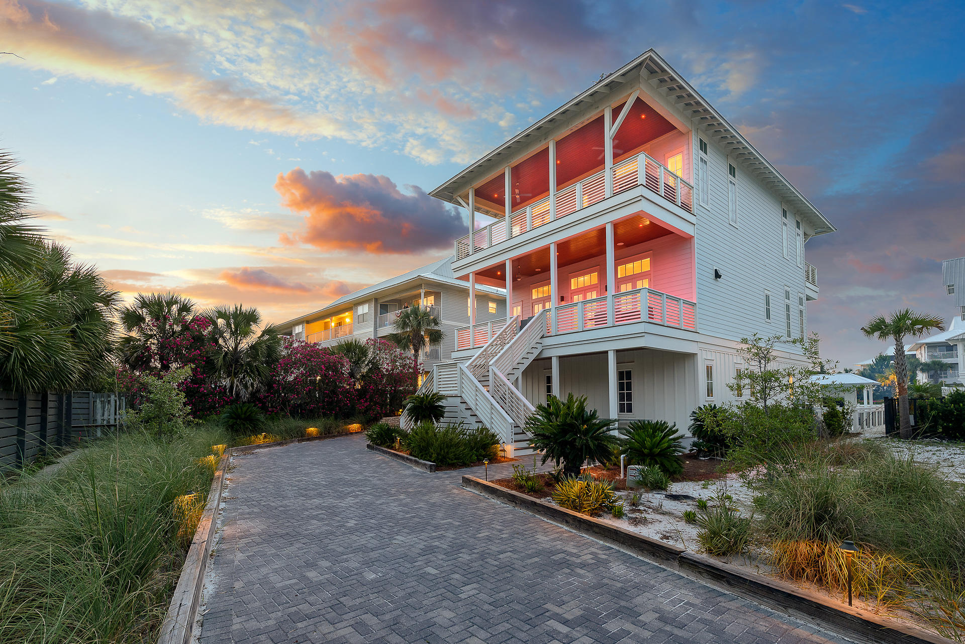 Masterfully built and thoughtfully designed by industry experts, ''MisChivas Mermaid'' is the epitome of coastal beach retreat. In addition to the incredible amenities and finishes, 360 Blue Properties is offering a $300,000 annual rental revenue guarantee through December 31st, 2021 to the buyer. Incredible gulf views from both the second and third floors of the property offer the opportunity to enjoy the beautiful emerald waters right from your own porch. The private deeded beach access will have your feet in the white sand within seconds. Step into the first floor of the property to find a space created for the kids, but will make all ages feel like a kid again. This includes a large multi-media room boasting two pinball machines, a ping pong table, large TV, and huge sectional, all opening up to a one of a kind pool. There are 2 large bunk rooms, sleeping 8 and 10, respectively. Each bunk room has its own locker room style bathroom with a large triple vanity and 2 shower stalls in each. The first laundry room can also be found here off the living area.

As you climb to the second floor you will be welcomed by the amazing gulf views. This second floor showcases the main living area of the home. This includes a huge dining area with room for the entire family to gather. You will find a wet bar off the dining for convenient access offering a bar sink, under-counter fridge and ice machine. From the dining space move across the open concept to the incredible chef's kitchen. The kitchen boasts a built in 30" Subzero fridge, built-in 30" Subzero freezer, 48" Wolf range, 2 dishwashers, and a microwave drawer. No details or amenities were missed in this kitchen! The massive living space is located across from the kitchen and offers an area for the family to enjoy nights together and the wonderful views. Also on this floor you will find 2 king suites with private baths in each. Each suite offers balcony access overlooking the pool.

The third floor includes additional living space and even more gaming opportunities. In addition to the additional living, there are 3 private king on suite masters, with an additional double-over-double bunk bed with shared porch and en suite bathroom. You will also see the second full size laundry room here for easy access to all guests. All king bedrooms on the property offer access to a balcony with views.

Behind the home you will find a separate carriage house. The carriage house offers its own private kitchen, laundry, bedroom, bath and living. The first floor of the carriage house contains the 2 car garage, perfect for protecting your car from the elements as well as storing your beach items!

The most impressive part of the home is the incomparable outdoor living space. Deeded beach access is steps outside of the front door, allowing you to have your feet in the sand in seconds. Back of the property, the outdoor oasis complete with a massive 8x8 spa, sun-deck for tanning, huge resort-style two-tier pool with built-in swim-up bar & large TV to watch your favorite sporting event, amazing outdoor kitchen with large gas grill and sink, and full sized sand volleyball court!

Notable features of the property include an elevator to all floors; white oak hardwoods throughout; marble in many of the bathrooms; pecky cypress on the great room ceiling; quartz countertops; beautiful lighting fixtures; incredible plumbing fixtures; amazing tile on the back-splashes and bathrooms; 3 rinnai endless hot water systems; a metal roof; and much much more! Including all beds with an additional 6 in queen sized pull outs, the property offers sleeping for 30-35 comfortably.
