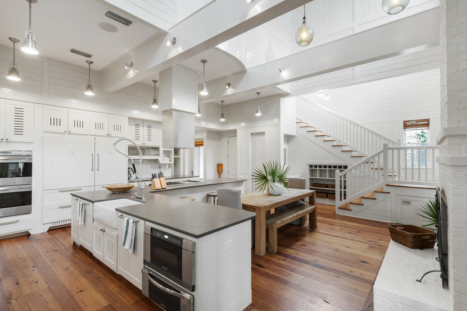 Rising above the norm, this bespoke WaterColor home is the ultimate residence for those who appreciate the very best. The recent T.S. Adams renovations include two new tower bedrooms, both with en suite bathrooms and kitchenettes for the ultimate guest accommodation. Set on a corner lot, this beach house extraordinaire includes an oversize two-car garage with storage room, an alluring new pool, and a huge screen porch with brick feature fireplace. Light and airy rooms with ample natural light make this a place to relax and chill out at any time of year. The flexible open-plan living space is yours to configure to suit your own individual needs.
You'll find ample space for socializing and entertaining, informal dining, and cozy lounge areas for watching TV or your favorite movie. There's double everything in the gourmet kitchen which boasts two Sub-zero refrigerators, two Bosch dishwashers and a Wolf 8-burner stove and oven for preparing a dinner perfect for a true epicurean! Anchoring the lofty atrium are two large, beautifully painted beams, it's enough to woo any keen chef or hard-to- please catering staff. Quartz adds its own mark of cool sophistication on the kitchen counters, and again in the tower kitchenettes and swish new bathrooms. WaterColor is an exclusive place to live, dine and play. Spend the morning on the tennis courts, hiking trails or pickleball courts before heading to the updated residents' Beach Club. When completed, it will boast three sparkling pools and a new beachfront restaurant along with the existing high-end amenities. Families and water babes will appreciate the new Camp WaterColor with its Lazy River, water slide and zero entry family pool. Beyond the gates, Western Lake offers endless recreation in a natural Florida setting. Go fishing, swimming, canoeing, or try your hand at stand-up paddle boarding. Within a two-mile radius, the area's restaurants and bars are just waiting to be discovered along with independent shops and boutiques in Seaside and Seagrove Beach.