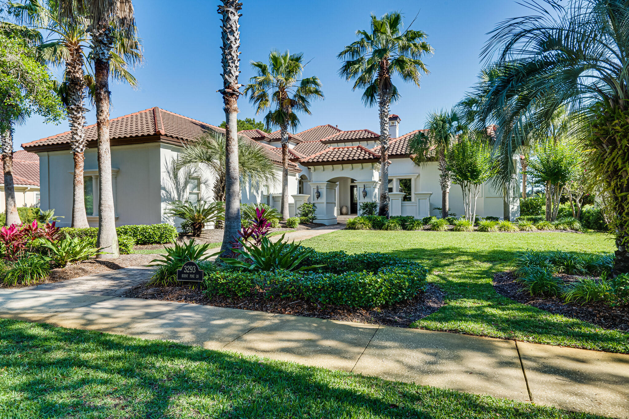 Experience lakefront living at its finest with this gorgeous home located at Sandestin Golf and Beach Resort's exclusive Burnt Pine community. Beautifully designed, no detail has been overlooked. This stunning Mediterranean inspired villa is characterized by traditional stucco exterior and interior custom features that include rich stone, textured woods, and exquisite wall coverings. The well-appointed first floor offers dramatic ceilings with tray lighting throughout, a private master wing, separate guest suite, and ample living areas. A temperature-controlled wine cellar complete a connoisseur's dream. The spacious family room flows graciously into an outdoor oasis where you will find an entertainer's paradise including a large climate controlled summer kitchen, stone fireplace, seating area,heated pool and spa, all with lake and golf views. A grand staircase leads to the second floor featuring two bedroom suites, a second expansive family room with wet bar, and an extensive deck that offers views of the lake and golf course green !