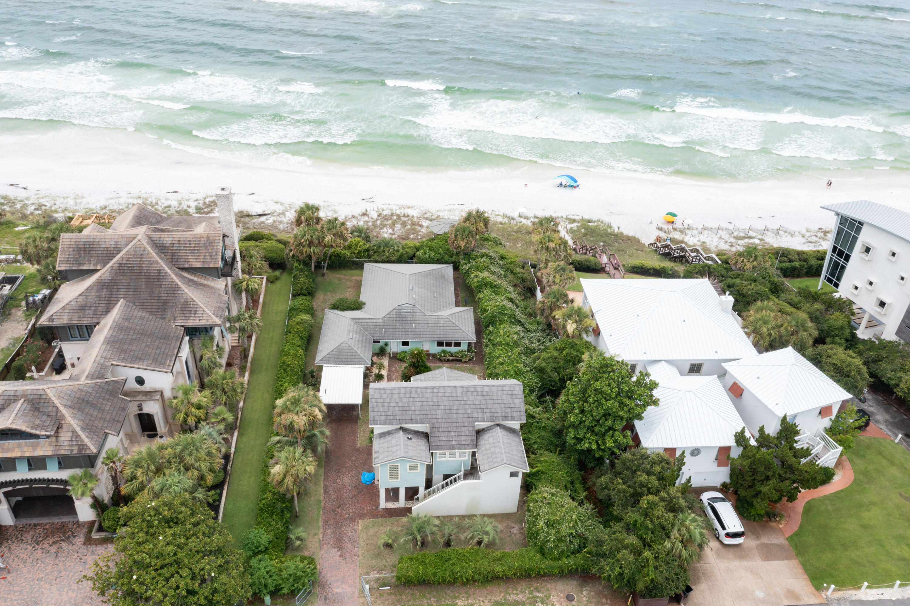 Perched high on the bluff in the desirable Seahighland neighborhood, this exceptional property boasts 87 feet of breathtaking Gulf front views.Explore various opportunities by updating the current home or utilizing the vacant lot to build your dream BEACHFRONT home in one of the most sought-after locations on 30A!
Nestled on this lot is a charming 1948 two-bedroom, two-bath house, exuding 1,100 square feet of Old Florida character. The property also features a private gazebo, perfect for enjoying cool breezes and panoramic Gulf vistas from its elevated position.Facing the street, you'll find a modern 2003 carriage house, offering 1,000 square feet of comfortable living space. This includes one bedroom, one bath, a kitchen, a living room, and a dining room, all easily accessible via an elevator. The carriage house also comes with a spacious, air-conditioned garage, two storage spaces, and a laundry room. Enjoy stunning Gulf views from the two outdoor balconies, providing a serene retreat for relaxation. This property has been lovingly built and occupied by the current sellers. Additionally, the location offers convenient access to three public beach walkovers on Montgomery Street, making it a prime spot for beach enthusiasts. ***Buyer is responsible for personally verifying details about this property.  Any information contained in this listing is believed to be accurate but is not guaranteed.***
