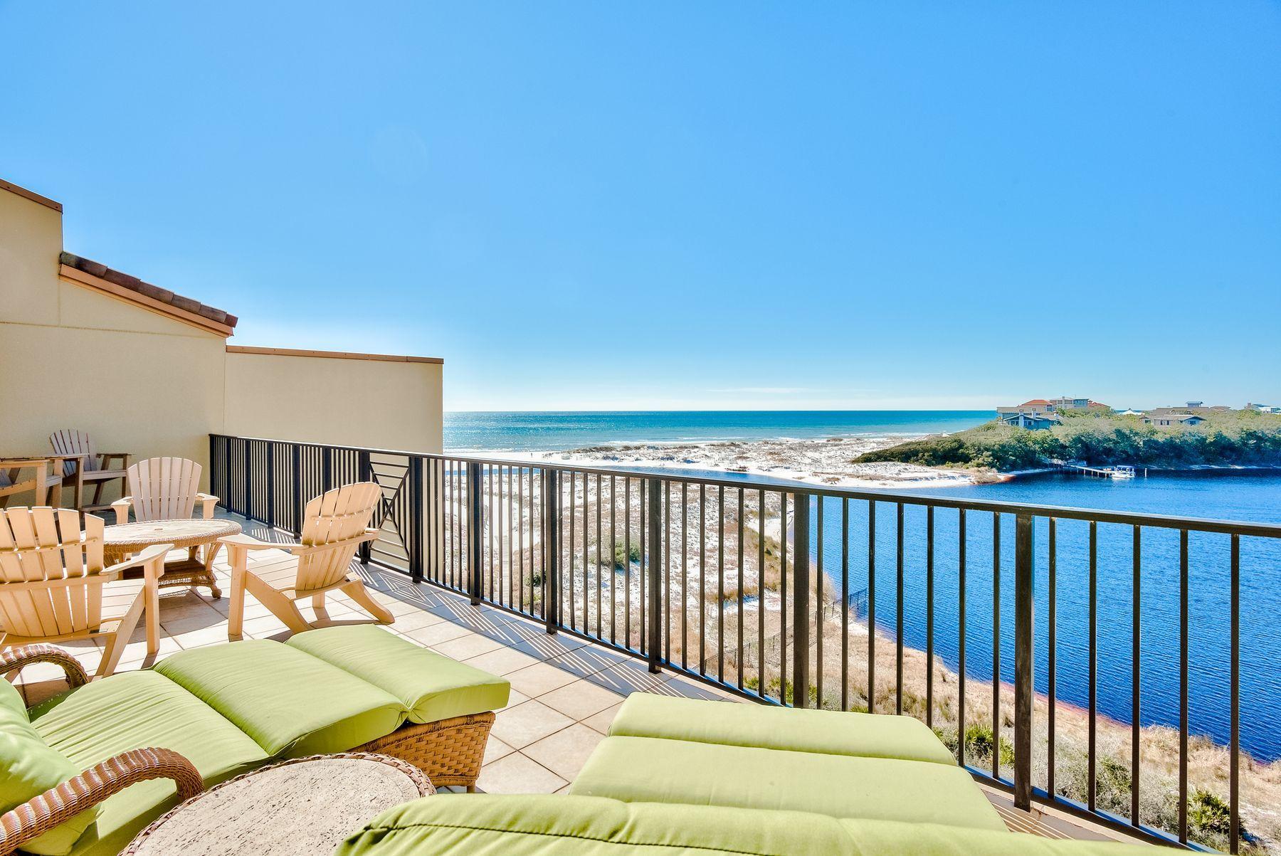 A luxurious vacation retreat, this elegant condo offers custom finishes, pristine amenities, and breathtaking views of the Gulf of Mexico and Big Redfish Coastal Dune Lake. A top-floor unit, this condo provides 3,154 square feet of living space with an open floor plan and four elegant suites. Thoughtfully designed, interior finishes include travertine flooring, custom lighting and high-end furnishings throughout. Perfect for those who love to cook, a spacious chef's kitchen features ample cabinetry, two large islands, granite countertops, and Viking appliances. Enjoy casual meals from the breakfast bar while a large dining area is ideal for gathering with family and friends. A wet bar features a custom backsplash and includes everything you need for preparing and serving drinks. Natural light streams through sliding glass doors, which also provide inspiring water views that can be enjoyed from several areas of the condo. Just beyond the glass doors, two expansive balconies offer serene spots for enjoying warm weather and sea breezes. The first-level balcony offers plenty of space to host meals and enjoy morning coffee, while the second-level balcony offers expansive space to lounge under the sun or enjoy a sunset cocktail.

A gated community, Sanctuary by the Sea provides a carefree beach living in a coveted 30A location. Residents enjoy access to several exquisite amenities, including pools, fire pits, spas, and grilling areas. Also included is access to the owner's clubhouse, which features a full kitchen, theater room, virtual golf, and a state-of-the-art fitness center. Enjoy access to a sprawling private beach as well as access to Big Redfish Lake from the convenient community dock.