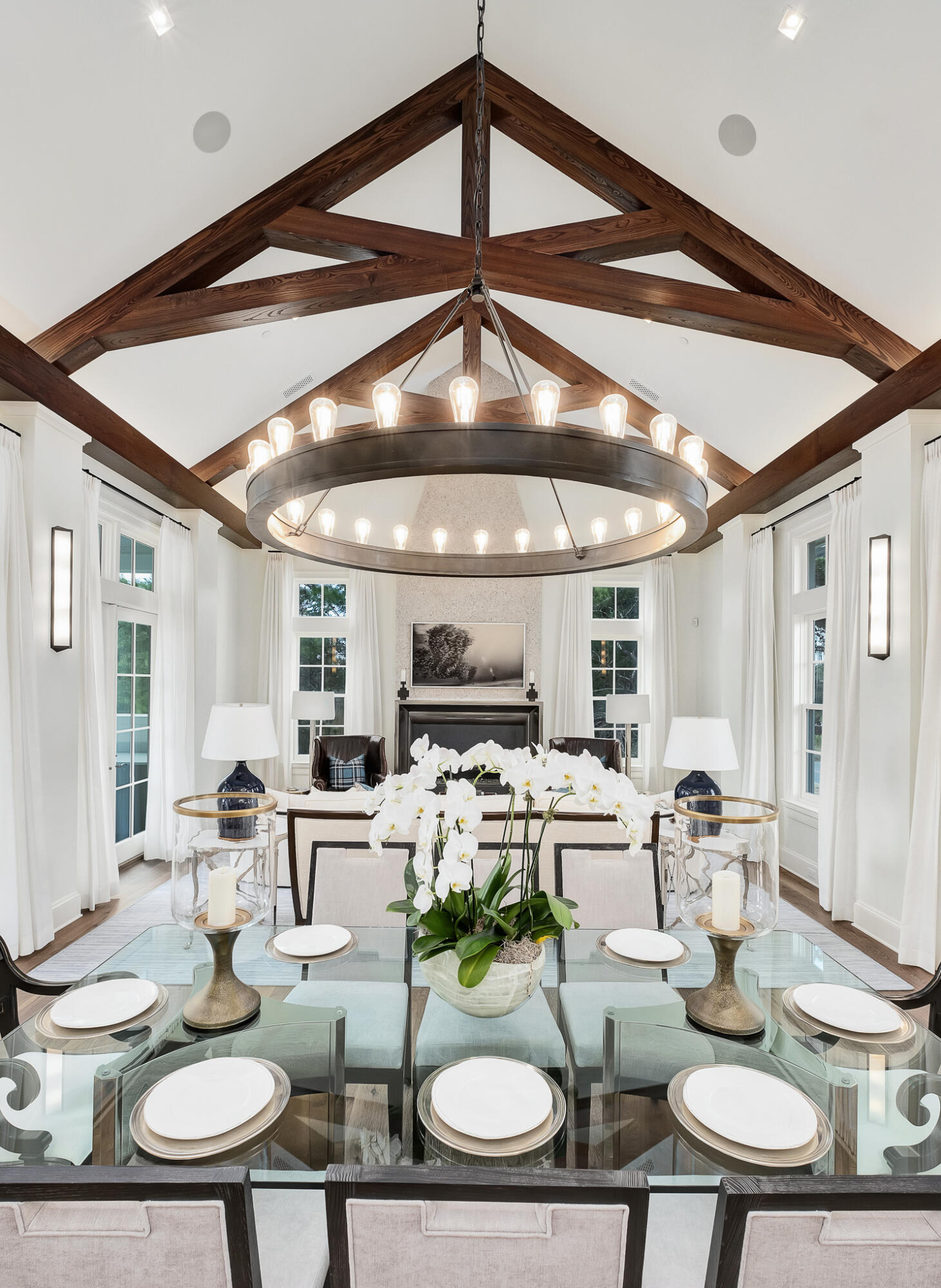 Primely positioned South of 30A and notably designed with striking architectural styling juxtaposed exquisite interior design, this exceptional legacy property is the marquee residence in the gated, gulf front enclave of Heritage Dunes. Thoughtful planning and curated visual & engineering design yields a magnificent coastal retreat comprised of 5 bedroom suites and 5 full & 3 half bathrooms, multiple living areas on each of it's impressive four levels as well as a top floor observatory with 360 degrees of glass providing beautiful views of the Gulf of Mexico and the natural foliage of Seagrove Beach.

This coastal contemporary masterpiece was beautifully rendered by Burwell & Associate's own Gerald Burwell, who partnered with Grand Bay Construction to bring the project to life. The ground floor includes two guest bedrooms, both with en suite baths, a powder room, and a fabulous first level living room, that opens directly out to the outdoor pool and private lanai. 

The home's second floor features a large open-concept gourmet kitchen, complete with side-by-side Sub Zero refrigeration, 48-inch dual fuel 6-burner with infrared griddle Wolf range, and Cove Dishwasher. A butler's pantry flanks the kitchen, and offers ample storage options, while an oversized Manhattan-cut quartzite island provides plenty of space for entertaining guests. The adjacent dining and living room area were artfully crafted with a lofty ash beamed ceiling. A coquina fireplace and custom designed mantle by Thierry Francois of Francois & Co serve as the focal point for the primary living room area. The soaring cathedral ceiling has a 12' plate height and a presence 16' vertical limit. If extra space desired, French doors lead directly onto the second-floor veranda to further extend the living room space. The second level also boasts the primary suite, which includes a wine and coffee bar and dual custom-built closets. A spacious walk-in shower and Kohler Memoirs freestanding tub provide a spa-like feel to the space. The primary suite also enjoys direct access to the wrap-around veranda and provides a connected feel to the entire second level of this home.

The third floor incorporates a seating room shared by the two additional guest bedrooms on this level. Both of the third floor bedrooms provide luxury on-suite bathrooms. Upon entering the climate-controlled fourth floor Tower/Sky Bar Room, you are greeted by window-filled Euro Walls, opening to provide the refreshing beach breeze and panoramic views overlooking the Gulf and surrounding foliage or closed for comfort and privacy.

The outdoor space was meticulously designed by architect Patrick Hodges. This exquisite space seamlessly integrates the pool scape, outdoor gardens and verandas with the natural environment surrounding the home. The resonant sound of water reverborating from separate walls into the southern exposure pool creates a soothing escape, while a pergola and colonnade present a perfect respite from the warm Florida sun. Heritage Dunes offers private beach frontage & access for owners as well as rental restricted privacy and gated entry. The south-side community pool and manicured grounds are added amenities that owner's enjoy. This prime location is nestled between the new urbanism communities of Seaside and Watersound while yielding excellent proximity to world class shopping, dining and entertainment that 30A is so prominently known for.