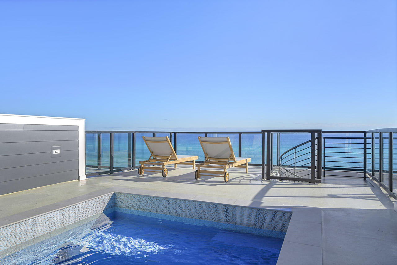 Henderson Beach Villas set a new trend in sophisticated coastal lifestyles on the Emerald Coast. Since completion in early 2021, residents enjoy private beach access, luxurious in-unit amenities, elegant design, and a premier location in Crystal Beach. Villa #8 presents a rare opportunity to own one of the area's most anticipated luxury beachfront projects. While many properties tout gulf-front luxury, few can also boast a private movie theatre, private rooftop gunite pool, 4 floors of outdoor space, and an in-unit elevator. Professionally designed by Duce & Co, this 3,160-sqft, 6-bedroom villa features 4 floors of luxurious interiors with porcelain and hardwood floors; high-impact retractable glass sliders; 10' first-floor ceiling; quartz, marble, and quartzite surfaces in kitchen and baths; Sub-Zero and Wolf appliances; and custom shaker cabinets.