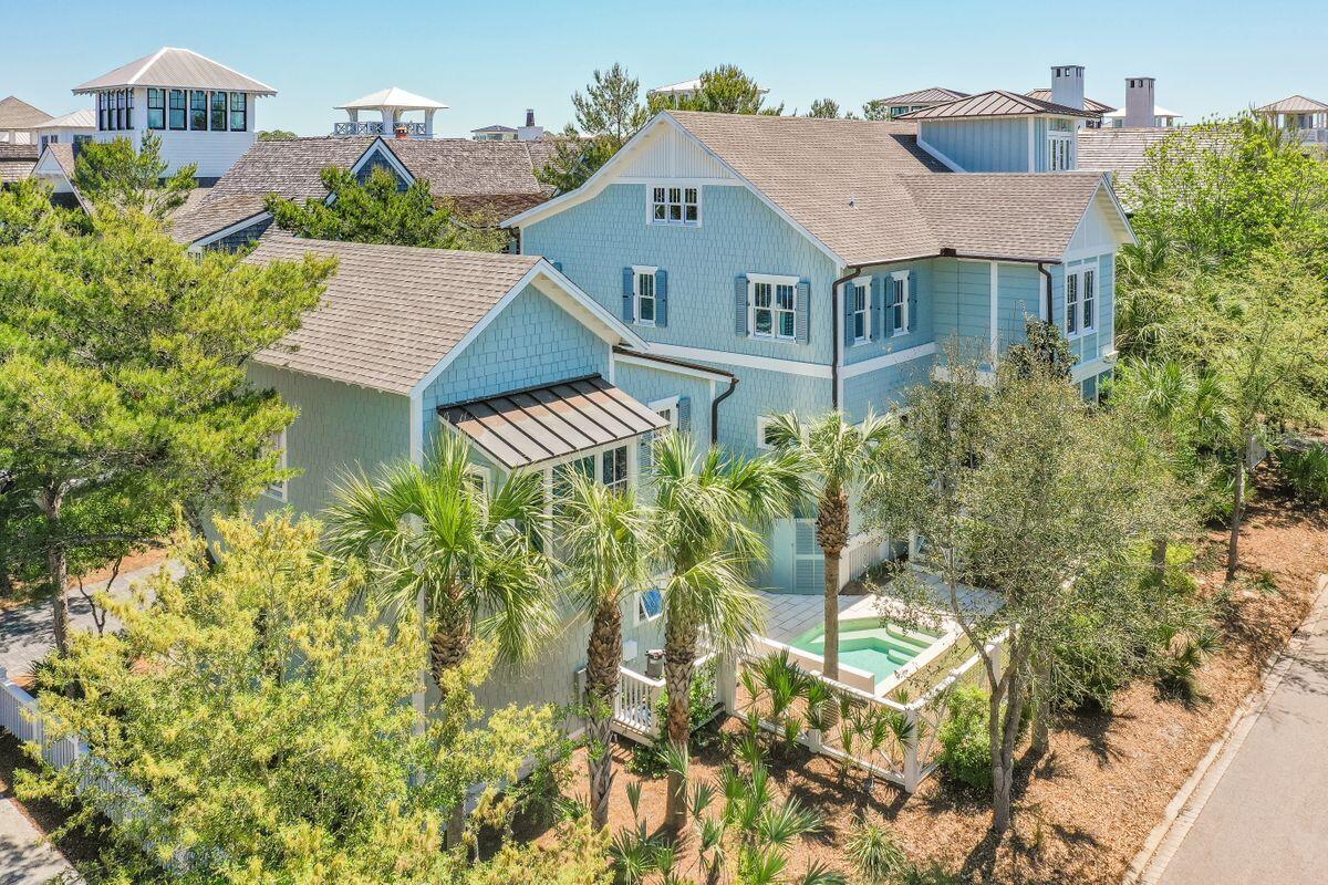Property currently under contract and accepting backup offers. This beautiful corner lot home in WaterSound Beach encompasses the classic beach lifestyle feeling. The casual sophistication of an open-airy floor plan is carried throughout both the main house and the carriage house. Natural lighting is amplified through the entire home by wall to wall windows, light-colored design features, and shiplap ceilings. Depth and dimension is pronounced by contrasting finishes like metal fixtures and a hand hewn beam mantle on the fireplace in the living room. The expert professional design is especially prominent in the sizable chef's kitchen, complete with a farmhouse style sink, commercial-grade stainless steel appliances including a gas range, dual ovens, exceptionally large refrigerator, and... separate matching ice maker. Spa baths are attached to their respective suites which feature ample space and balcony access. Each of the 5 full bathrooms includes either a zero threshold shower, dual vanities, a soaking tub, or a combination of 2 out of 3 of these luxury additions. 6 bedrooms provide abundant space for accommodating large families and multiple guests. To further compliment the beach appeal, the close proximity to the Emerald Coast affords this home a Gulf view from the top floor. The private pool is centrally located between the carriage house and the main house, convenient for a refreshing cool dip after a long day at the beach. This home is the perfect getaway and is a must see if you crave the best that 30A offers