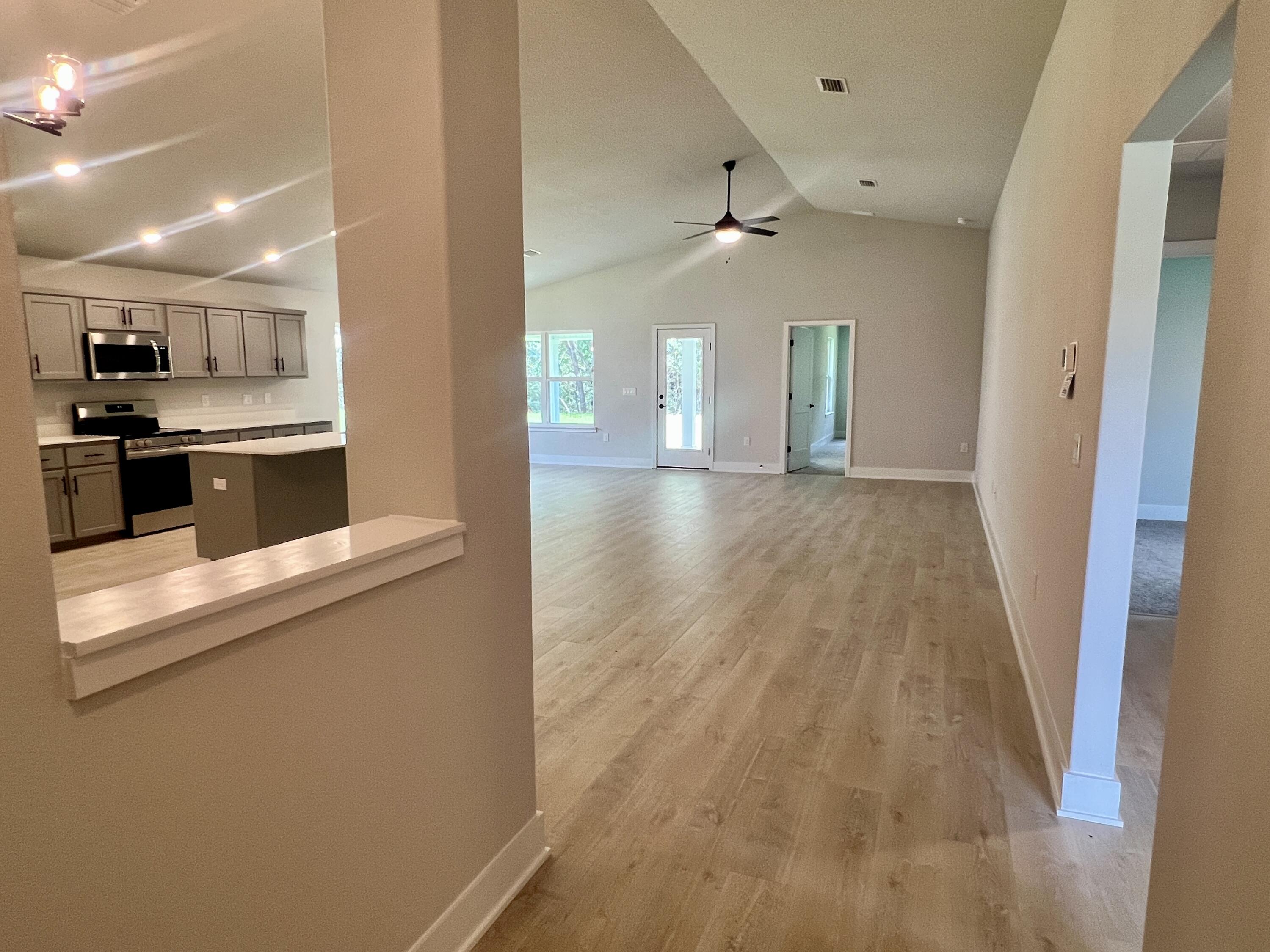 Welcome to HIDDEN PINES by Adams Homes. Located just 30 minutes to Navarre Beach, with close proximity to schools, shopping and much more. This home is 3-sided brick with Hardi design front, 2 car automatic SIDE ENTRY garage, sprinklers with timer, and a sodded yard with a landscaping package. Some upgrades that are being added to this home include granite/quartz countertops in kitchen and bathrooms, Puretec LVP flooring everywhere with carpet only in bedrooms, craftsman style elevation, garden tub and separate tiled shower in the master bathroom.