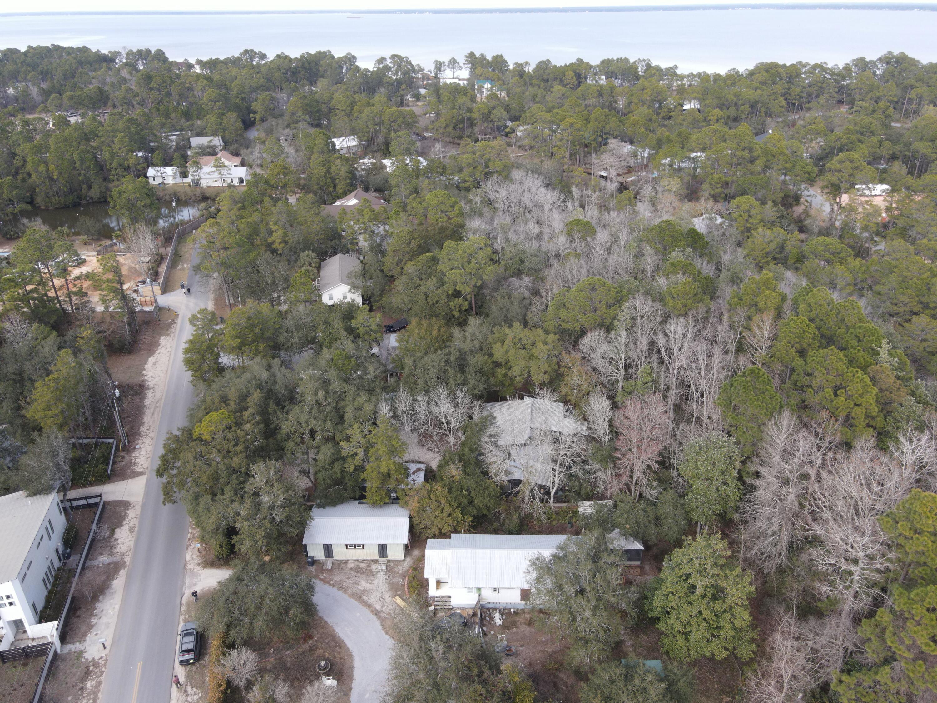 Great opportunity to finish a renovation to suit or take down and build a large home on this spacious lot. Less than a 10 minute car ride to the emerald green waters and sugar white beaches of the Gulf of Mexico. Easy access to 331 or hwy 98 make this location optimal for anyone. Quiet neighborhood, beautiful landscapes surround the house on this half acre of land. A freestanding out building with electricity located in the backyard adds lots of extra storage or maybe full workshop. Perfect for investor looking to be subdivided and build to suit. Buyer to verify all dimensions