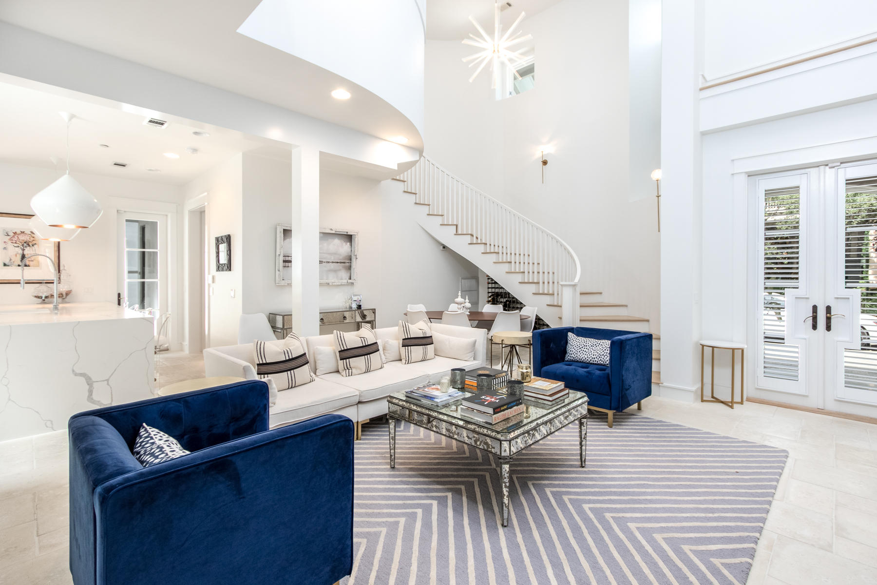 This spectacular contemporary residence is perfectly situated on a coveted oversized corner lot in beautiful Rosemary Beach. High-quality construction is apparent upon entering an inspiring great room with two-story soaring ceilings, a feature fireplace, and a winding staircase. Designer lighting fixtures can be found throughout this 3,322 sq ft home. A gourmet kitchen features Wolf and Sub-Zero appliances, a Scotsman pellet ice machine, Cambria quartz countertops, and wood shaker cabinets with soft close doors and drawers. Double doors lead out to an exquisite private outdoor courtyard with beautiful landscaping, a large saltwater pool, outdoor fireplace, summer kitchen and water fountain and three outliving living spaces. Porches on the second floor offer serene places for relaxing.... with a cup of coffee or novel on mild weather evenings. In addition to three full bedrooms, the main home also features a loft area, a bunk room and an office. An ideal primary residence, vacation retreat, or rental investment with projections of $174K-$203K, this property includes a two-story carriage house for guests with a spacious bedroom, full kitchen, living room, one-and-a-half baths, and a wraparound porch. This home also has a large two car garage. This beautiful property is being offered fully furnished with the exception of a small exclusions list available upon request. 

Rosemary Beach is one of South Walton's New Urbanist Communities offering world class amenities including a tennis center, and boasts stunning West Indies style architecture, almost a half mile of private white sandy beaches, charming boutique community pools and a modern "owners only" club with pool and entertainment clubhouse. With close proximity to Rosemary Beach's Town Center, as well as to well-known restaurants and boutiques, this sophisticated home offers plenty of ways to enjoy some of the area's most popular amenities.