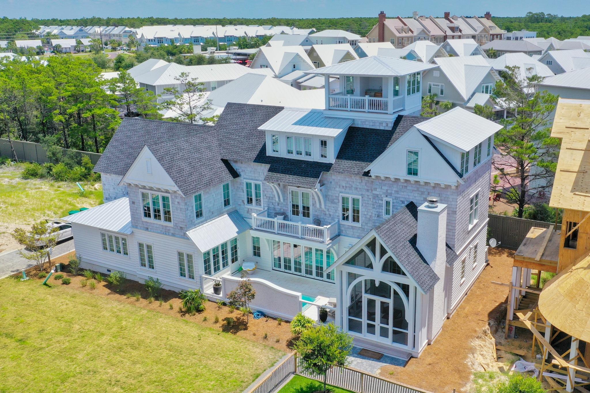 Amazing views of the Gulf from this architecturally designed beach home in Grace Point on 30-A. This home was designed for family living offering multiple bedroom suites and family areas to gather. The gorgeous hardwood floors are made from reclaimed barn wood and the 300 year old beams throughout the home are spectacular. The chefs kitchen features custom cabinetry, an oversized island, Sub Zero and Wolf appliances, quartz countertops, and a custom wine cellar. There's an outdoor kitchen and fireplace surrounding the pool.
The first floor master suite features Carrera marble, a walk in shower, and custom cabinets and opens to a private courtyard. The second master bedroom suite located on the third floor features a morning kitchen and a bath with  a walk in shower and a soaking tub, Carrera marble, and large walk in closets.

The fourth floor tower offers spectacular views of the Gulf and amazing sunsets!  The Watersound Beach Club is easily accessed from the home!  
So many amazing features in this home!  A new reverse osmosis water filter and a water softener were recently added. 
This spectacular home is a must see!