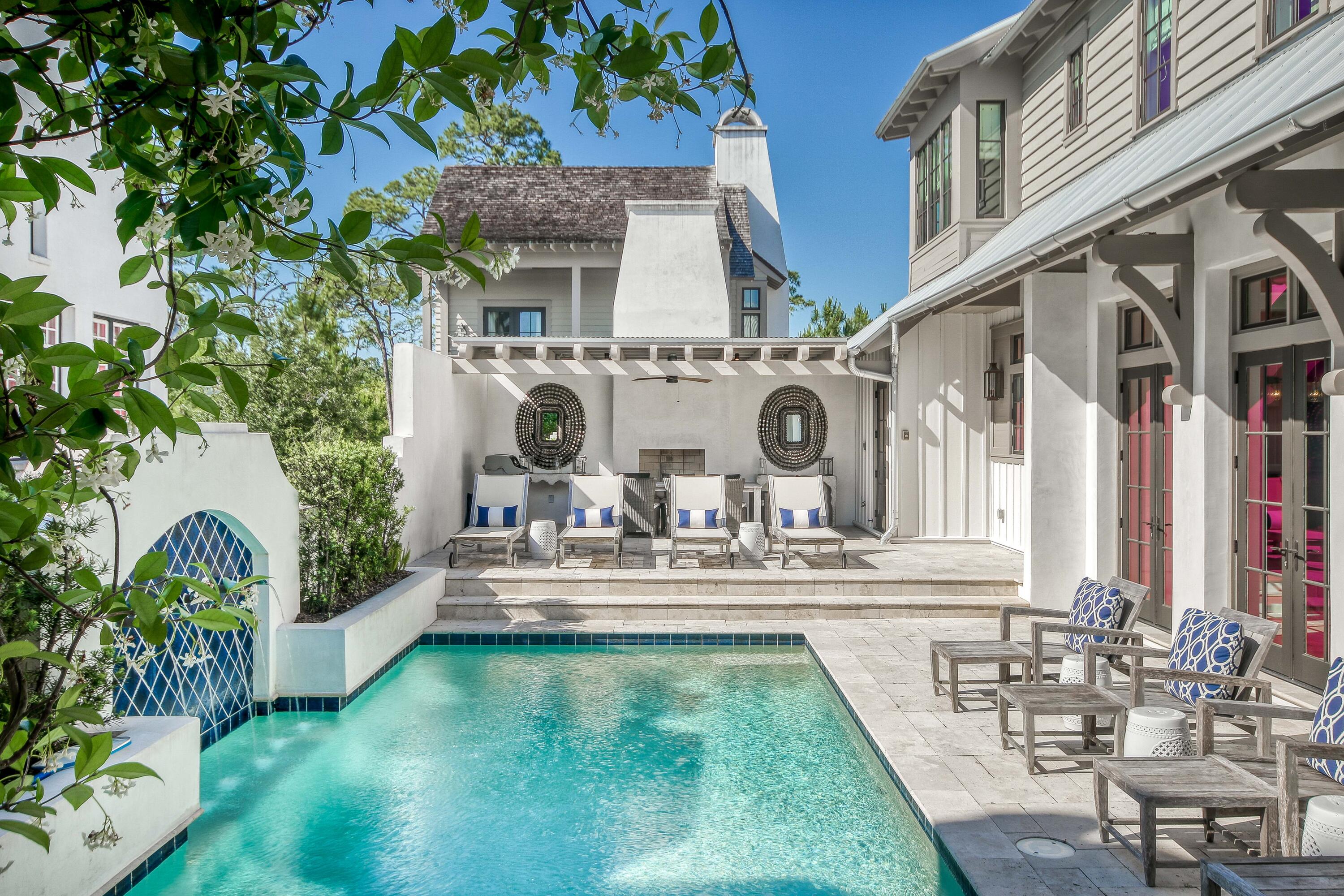 ACCEPTING BACKUP OFFERS. Coastal elegance and modern luxury find their influence throughout this custom-built 3,836 sq.ft. residence located on one of the largest, and quietest lots in Rosemary Beach. Perfect for full-time living, as it was originally designed, or as a rental investment with over $298K in projected rental income. Curated selections create a unique continuity throughout the home, and elegant, tasteful finishes won't require an update. The first floor features an open and airy 2-story living/diving area with stone flooring, and a large eat-in kitchen with custom cabinets, wire-brushed oak flooring, a butler's pantry, and mudroom. This open first floor space leads out to the peaceful courtyard with an oversized pool, lounging area, and covered dining space with an outdoor gas fireplace - the concrete walled exterior provides ample privacy for the pool and courtyard. A Guest Master Bedroom with King bed and full bath, finish out the first floor. The second-floor layout provides a distinct separation between the Master Suite and Guest Bedrooms on this level. The sizable Master Suite is outfitted with 2 private balconies, shiplap vaulted ceilings, a walk-in closet, and large master bath with separate soaking tub. On the other side of the home are 2 additional Guest Bedrooms that share a full Jack and Jill bath, with additional space for a secondary washer/dryer. The detached Carriage House features a gas fireplace, fully equipped kitchen, separate bedroom, and a sleeping loft. The private outdoor deck is great for entertaining with a cozy outdoor fireplace, and overlooks the beautifully landscaped dog park. If you are looking for a move-in ready home, with gracious indoor and outdoor entertaining areas, this is a must-see! Buyer to verify all measurements.