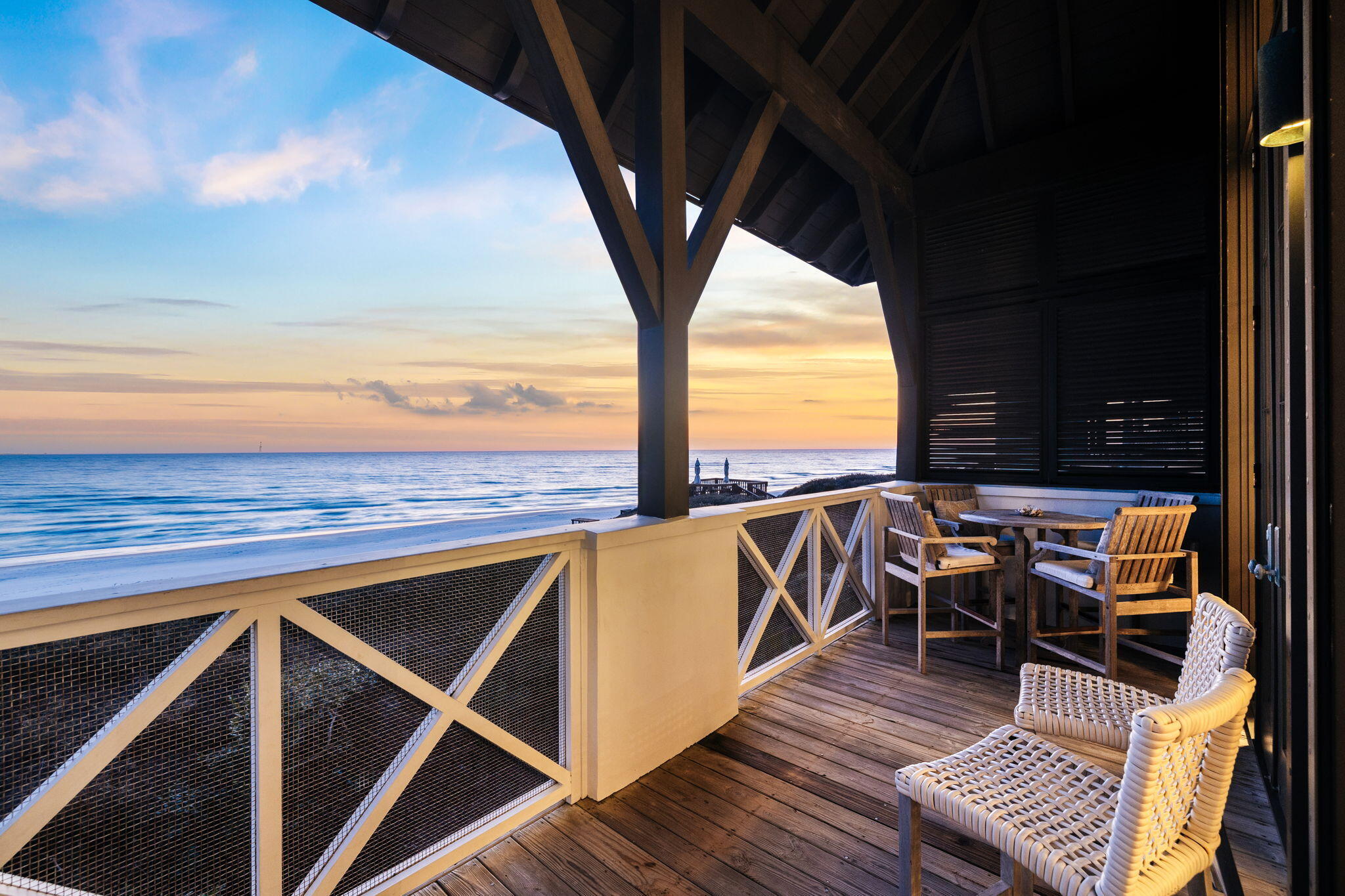 A rare opportunity to own the only Gulf-front residence currently available in Rosemary Beach, designed by renowned architect Ken Tate and recently renovated by Kelly Butler Interiors. This timeless coastal cottage blends refined architecture, thoughtful livability, and breathtaking Gulf views in one of 30A's most coveted locations.
Classic European-influenced details, French doors, and transom windows define the exterior, while the interior offers vaulted ceilings, open sightlines, and seamless indoor-outdoor living. Multiple porches and decks extend the living space toward the Gulf, ideal for everyday enjoyment and entertaining. The home features a serene primary suite with fireplace and screened porch, additional guest suites with Gulf views, a dramatic second-floor living area with 20-foot vaulted ceilings, fireplace, and Gulf-front porch spanning the width of the home. A chef's kitchen with high-end appliances anchors the living space.
A charming carriage house provides added privacy and flexibility with its own kitchen, living space, and Gulf-view porch, connected by a unique bridge. Featured in Coastal Living, this exceptional property captures the essence of sophisticated Rosemary Beach livingwhere craftsmanship, location, and coastal beauty converge
