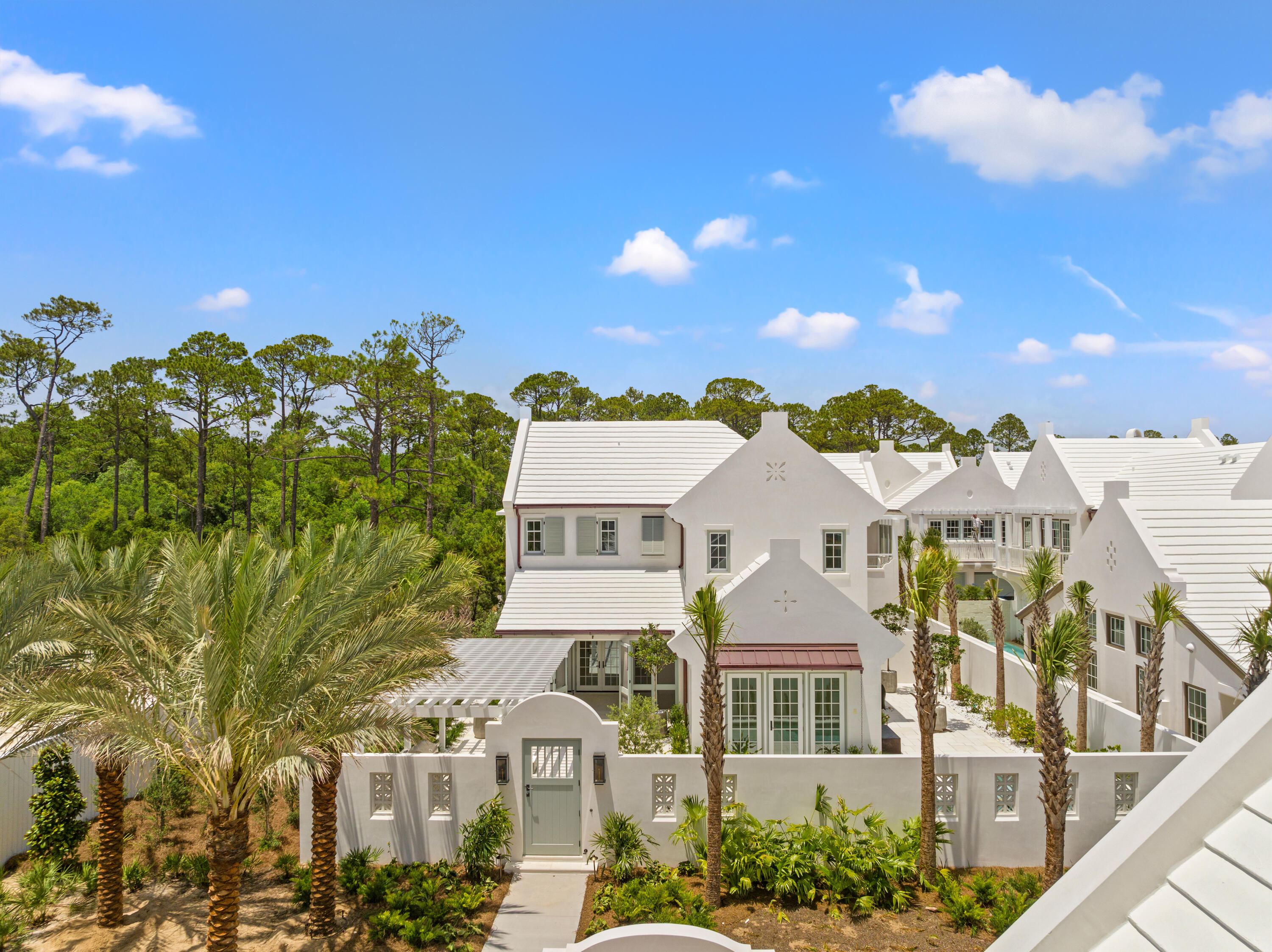 This Somerset Home, GG12, features streetscapes characterized by white garden walls that open onto a rugged natural landscape. A neighborhood that is bit more ''Country'' than ''Town.'' Much emphasis was placed on outdoor living with an open arrangement of interior spaces extending outdoors with garden rooms and courtyards shaded by trellises and arbors. Outdoor gathering places with firepit alcoves, water features, thoughtfully placed pools, covered summer kitchens and bars, and screened garden rooms are designed to maximize each property's use and enjoyment. GG12 fronts the 20-acre Nature Preserve, in close proximity to the The Silva amenity to be delivered in the GG Block. The Silva will be comprised of a central event lawn, an enclosed pavilion opening onto the event lawn, pool, and