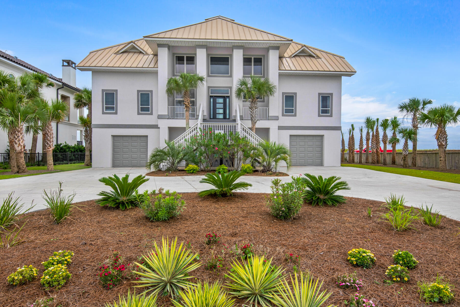 Aptly named ''The Oasis'' this spectacular 4 Bedroom 3.5 Bath Gulf Front home rises above 100 feet on Navarre Beach offering unparalleled sunrise and sunset views.  Custom designed and attractively furnished with 3777 heated and cooled square footage, as well as generous outdoor living spaces on both levels delivering an exceptional waterfront living experience.  Expansive open concept living area with soaring ceilings and floor to ceiling windows showcasing the breathtaking gulf views. The large kitchen marries the dining and living room and is ideal for enjoying family and entertaining while cooking.    In addition to 4 Bedrooms, The Oasis features an office adjoining the living area enjoyed as a 5th Bedroom plus 2 ''stowaway'' sleeping areas.  Freshly painted inside and out.  Numerous updates and upgrades.  Two car garage and circular driveway provide plenty of parking for owners and guests. The Oasis is a very popular vacation rental/ second home - rental history and projections are available upon request.