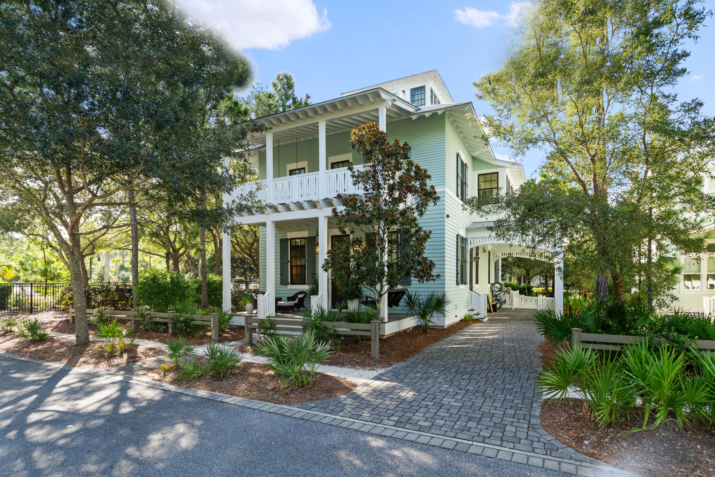 Prominently placed on Wood Fern Park in the charming community of WaterColor. This awe-inspiring home possesses all the features and elements you could dream of. Designed by Dungan & Nequette Architects and built by Chris Clark Construction, this home hits all the high notes and gives new meaning to attention to the detail! From the Main Level to the Mezzanine and Roof Level Cupula you are fortunate to overlook the recently remodeled Camp WaterColor and all that nature has to offer from Wood Fern Park. 
Recently updated and professionally furnished & decorated you and your family will enjoy 309 Spartina for years to come. 
The Main Level entry with rocking chair front porch, stunning entry way, kitchen, screen porch, dining area, living room with Tabby fireplace, and media room give way to the backyard porch with Tabby fireplace overlooking the Wood Fern Park and steps to the recently renovated Camp WaterColor.  The Second Level boasts the Master with an exclusive covered porch and three Guest Bedrooms all with private bathrooms. The open staircase with on-site hand wrought iron railings wraps around and will take you to the third Level Mezzanine with living area, bunks, ½ bath and eating nook. Vaulted wood beam ceiling crowns the Fourth Level Cupula with 2 overlook porches with views for days.