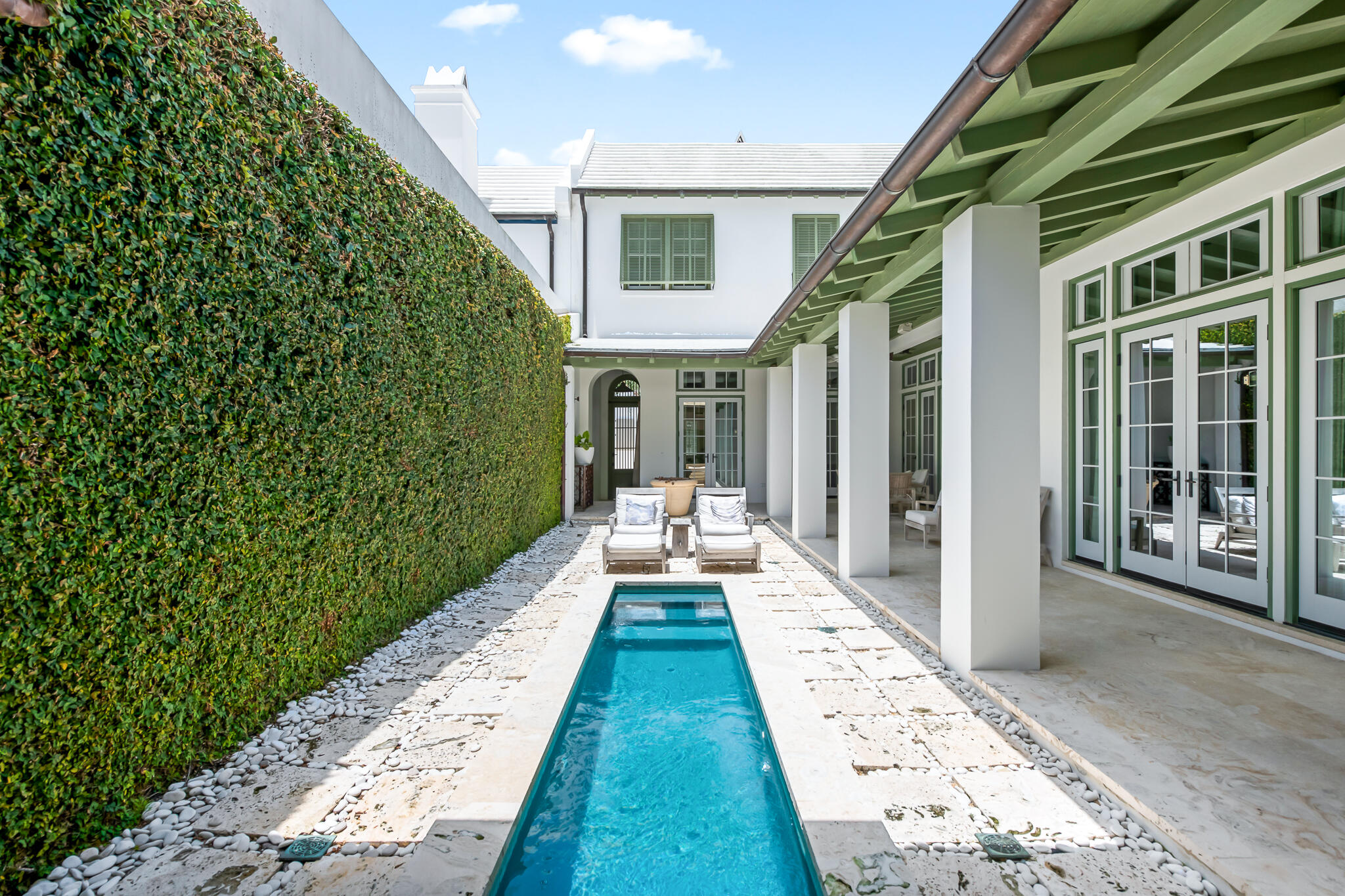 Quintessential Alys Beach courtyard home offering 3 BR, 3.5 BA and a second floor flex space is all masterfully designed by architect, Gary Justiss. Prime location fronting North Charles street with close proximity to Caliza Pool and Restaurant and Town Center. The serene private courtyard is surrounded by a generous shaded loggia overlooking the dipping pool and courtyard walls covered by lush creeping fig. The open floor plan kitchen, dining and living areas are finished in hand-applied Venetian plaster and flooring is Dominican Shellstone. 
The kitchen, with a limestone topped island, boasts top of the line appliances: Subzero refrigerator, Wolf 6-burner range with pot filler. Custom wormy oak cabinets and doors are found throughout the home matching the stained oak flooring on second level. Opening to the courtyard, the living room with fireplace, graceful arches and French doors creates a welcoming gathering space.

The first floor Master suite frames the courtyard and overlooks the pool. The Master bath offers a relaxing haven with an arched grotto inspired soaking tub, skylight, Mexican Beach Pebble tiled shower floor and double vessel sink vanity.

Two spacious bedrooms, each with private baths, children's flex space and rooftop terrace perfect for starry evenings complete the second floor. Built to "Fortified...For safer living" standards. Home is being sold furnished and has rental linens and kitchen package already in place. Two assigned spaces in parking court.