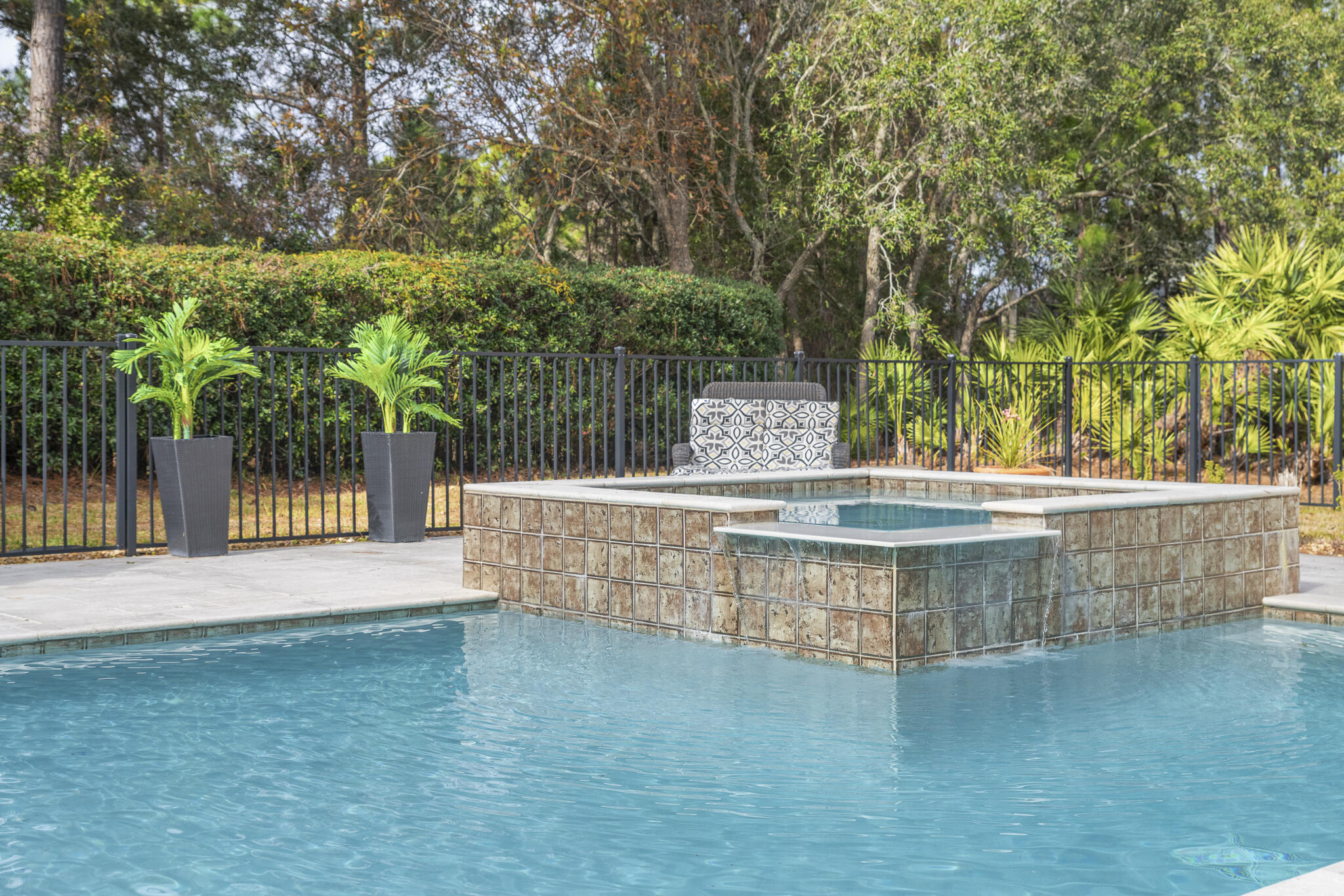 PRIVATE OASIS retreat with massive Heated Pool/hot tub in the gated Golf Course Community of Emerald Bay. Lush greenery shields views from neighbors. Double, screened lanai w/ multiple fans. Master suite on 1st floor. Bonus family room/office w/ bright view of pool. Circular drive outside Grand Entryway greets guests.
