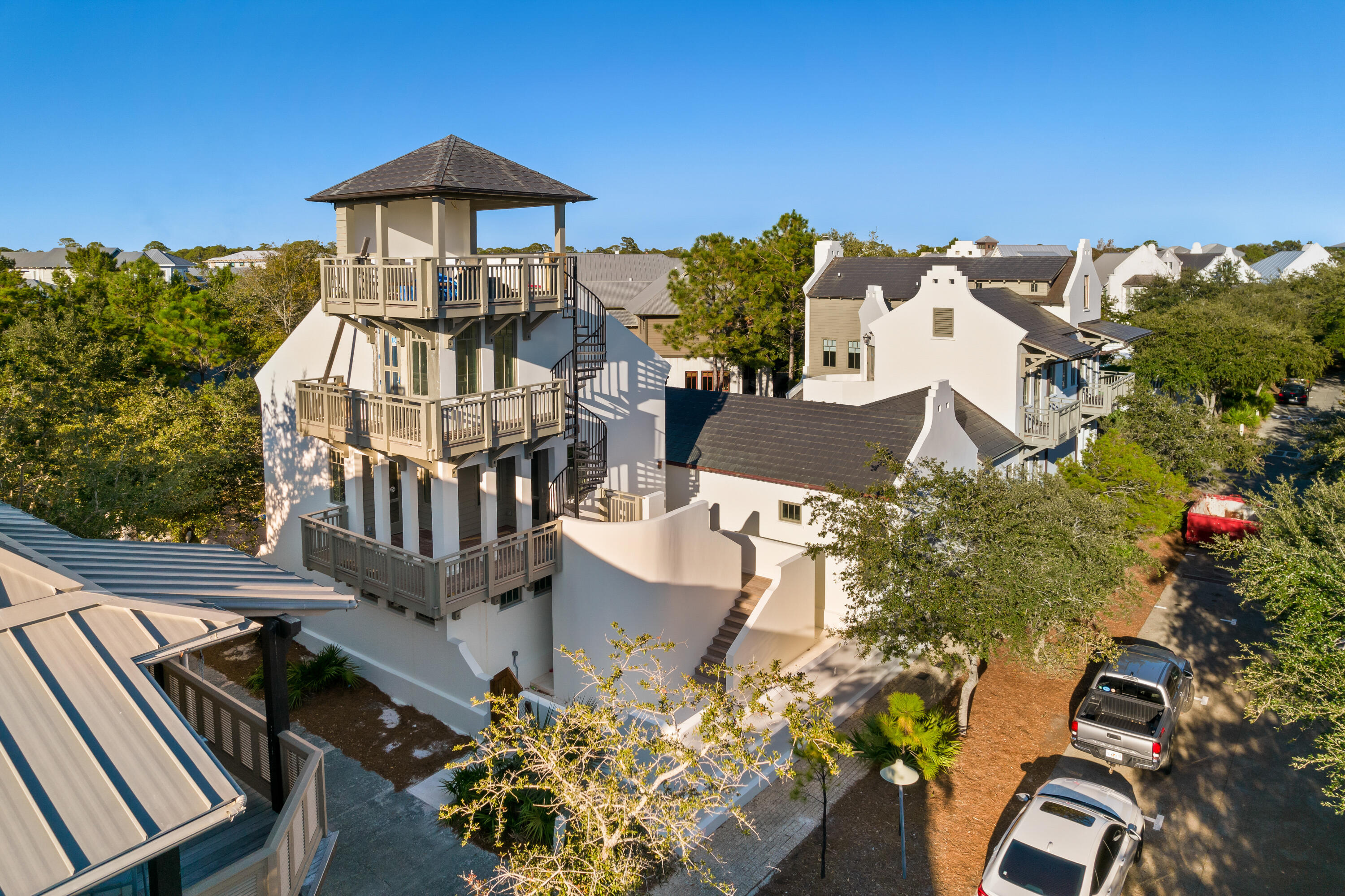 Situated on one of the largest home-sites in Rosemary Beach, 102 W Water Street presents astonishing architecture in the most sought after community on scenic highway 30A. Extraordinary design characterizes this fully renovated, like-new estate. The expansive gated compound showcases gulf views; an oversize pool and spa; a large main house; spacious guest house; multiple fireplaces; unexpected outdoor living; a roof top terrace and a two car garage all within the privacy walls of the property. Positioned on the corner of W Water and Johnson, this home offers seven bedrooms, seven full bathrooms and one half bathroom. Curated perfectly for primary or secondary living; design features of the home include venetian plaster, white-oak custom cabinetry, shell-stone flooring on the main level and reclaimed hardwood flooring throughout the remaining areas. Luxury plumbing and lighting fixtures were uniquely selected for each space of the property. 

The well-thought-out floor-plan boasts a large open concept great room, chef's kitchen and main level master suite. The luxury kitchen features a fourteen foot island with two sinks; a 48" Wolf range; Sub-Zero refrigeration; scullery with an additional sink and microwave; a beverage area with undercounter fridge and ice machine; and a built in dining area. The master suite is highlighted by a wood burning fireplace, free-standing tub and large walk-in shower. In the main home on the second level three additional guest suits can be found. The top level of the main home is dedicated to a large bunk room featuring three twin bunks and one queen bunk. 

The carriage house features a full kitchen and living area as well as an additional guest room, bunk room and two bathrooms. The roof top terrace is found on the roof of the carriage house. On this veranda, residents will enjoy gulf views and the ultimate entertaining space. 

The outdoor living of the property is truly unparalleled in Rosemary Beach. Featuring an oversized pool, spa, outdoor kitchen and multiple courtyards, future residents will truly enjoy an oasis retreat without leaving the property.