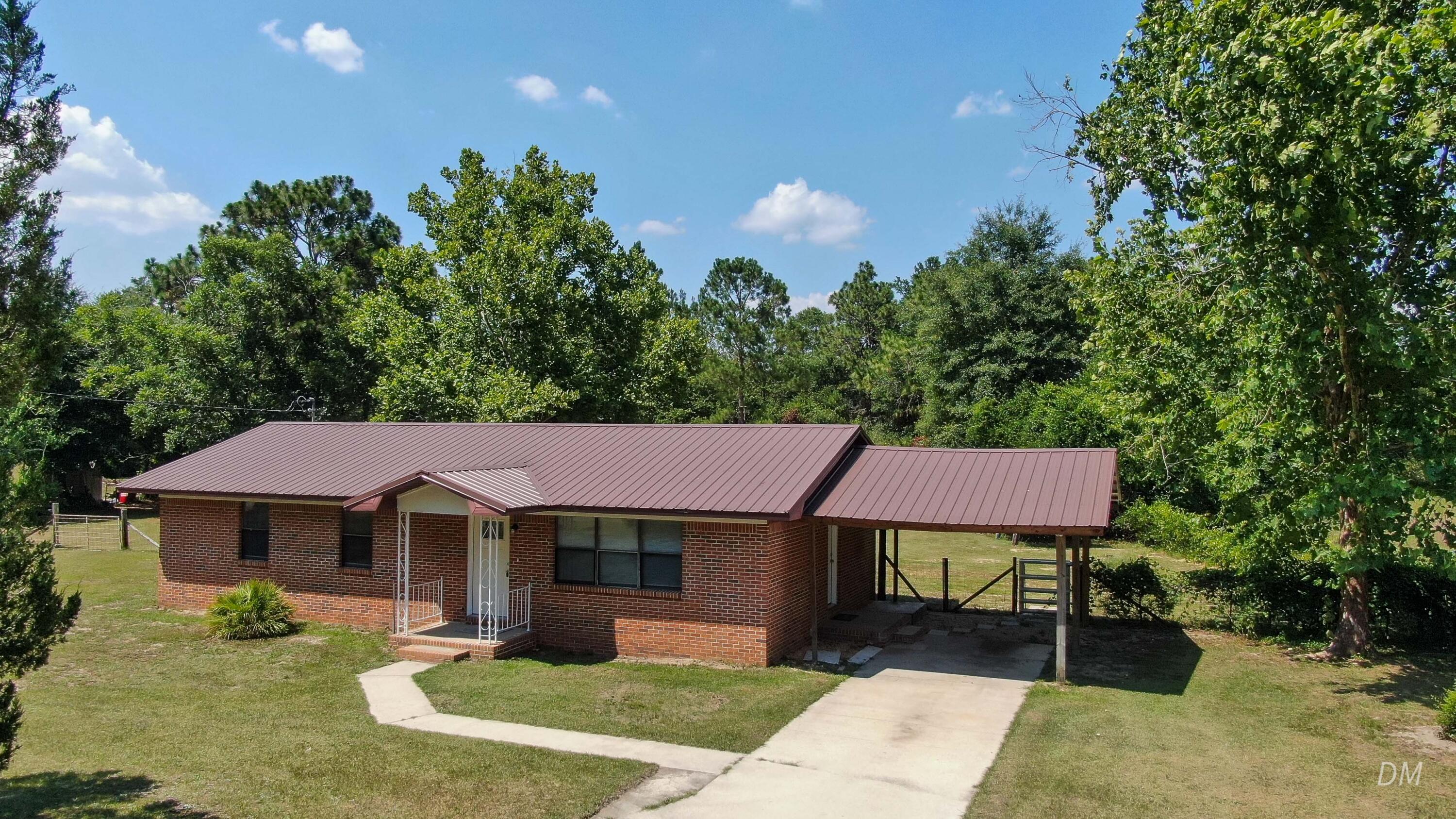 Short sale--subject to lender approval. Home is priced below recent appraised value. Seeking a patient, qualified buyer as the approval process can take time. Excellent opportunity for the right buyer.

This 3-bed, 2-bath brick home on 1+ acre east of DeFuniak Springs is move-in ready. Enjoy updated bathrooms, tile floors, and a stylish kitchen with painted cabinets, modern countertops, and reliable appliances. Metal roof (10 yrs or less), windows (2022), and HVAC (2 years old) offer peace of mind. Water heater is 3-4 years old.

Out back features a spacious 30x40 barn, perfect for storage, hobbies, or workspace.