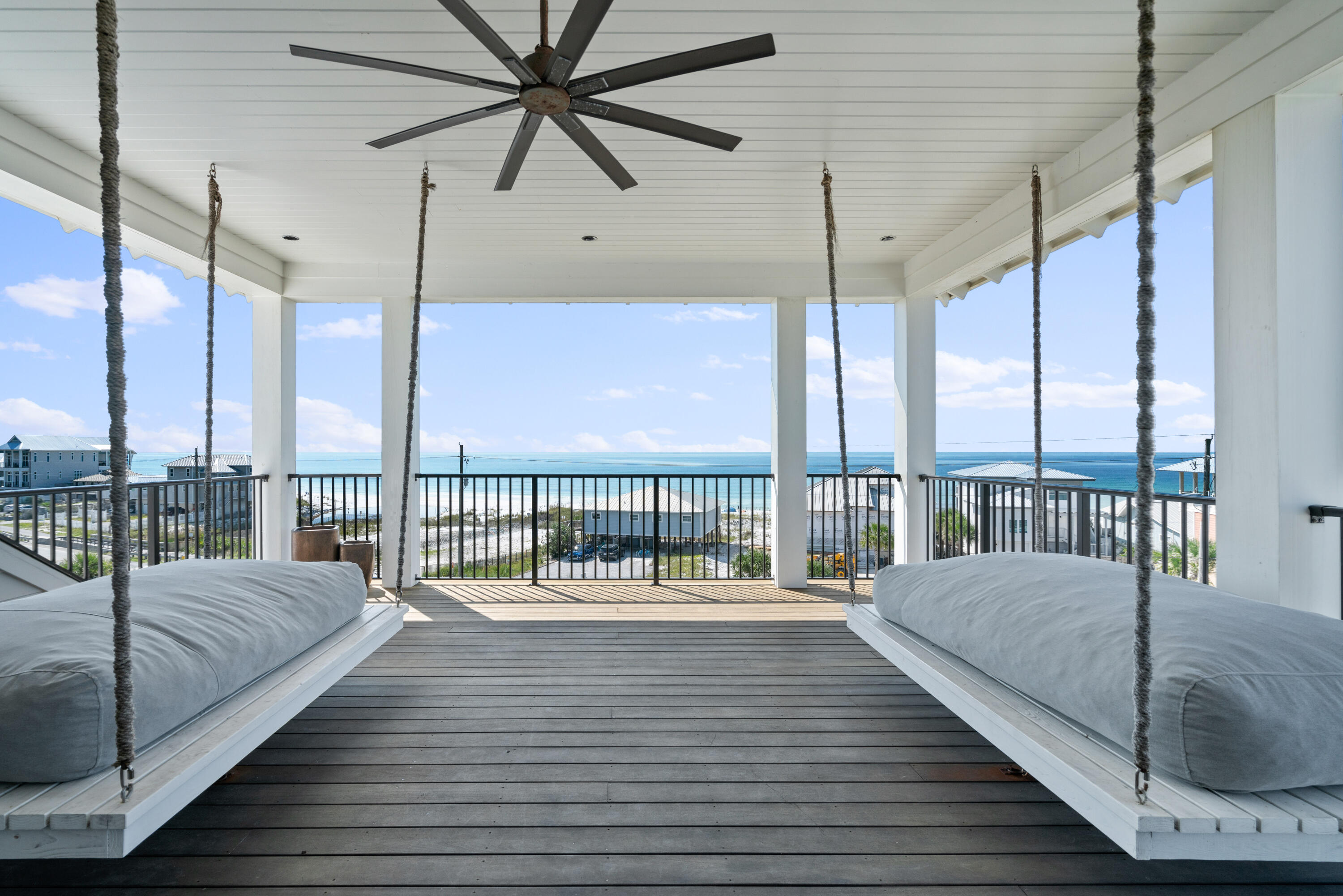 Situated along the scenic western end of 30A, this stunning coastal retreat spans over 5,700 square feet of thoughtfully curated living space. Designed for effortless entertaining and memorable gatherings, the home is perfectly positioned to capture breathtaking views of the beach, the Gulf, and the vibrant Dune Allen community. Just a short stroll away, two convenient beach access points open to an expansive stretch of shoreline, promising endless days of seaside enjoyment for family and guests alike.

Exuding timeless craftsmanship and superior quality, this residence showcases luxurious finishes, including white oak flooring, designer lighting, high-end fixtures, and premium appliances. Custom millwork enhances its character, with rough-sawn oak beams, bespoke cabinetry, and rich wood-paneled walls adding warmth and sophistication.

Modern convenience is seamlessly integrated, featuring state-of-the-art security and an advanced audio-visual system. Expansive porches on every level invite you to soak in the mesmerizing coastal scenery, while the backyard is transformed into a private outdoor sanctuary, complete with a sprawling pool, oversized deck, and a charming fire pit.

Stepping inside, the ground level greets guests with a welcoming foyer leading to two beautifully appointed guest suites. This floor also includes a spacious recreation and media room with a wet bar, a stylish bunk room, and a well-equipped laundry facilityideal for relaxed, carefree living.

The heart of the home unfolds on the second level, where open-concept living areas are carefully designed to highlight the captivating Gulf views. The grand great room flows seamlessly into the chef's kitchen, which is outfitted with custom cabinetry, an extended Wolf range, dual dishwashers, Sub-Zero refrigeration, and a discreet walk-in pantry. Towering 12-foot ceilings with white oak beams, rich hardwood flooring, and a custom brick fireplace create an inviting yet refined ambiance. Adjacent to the dining area, an expansive outdoor living space features a summer kitchen, perfect for alfresco dining and entertaining. Tucked away on this level, the oversized primary suite offers a private retreat of unparalleled comfort.

For added convenience, a grand staircase or residential elevator leads to the third floor, which centers around a spacious secondary living area with access to a generous outdoor lounge and an additional wet bar. This level also houses two elegantly designed guest suites and a second laundry room, ensuring both privacy and functionality.

Crowning the home is the rooftop deck, an extraordinary space offering panoramic views in every direction. Whether hosting a sunset gathering or enjoying a quiet moment of reflection, this elevated vantage point provides an unforgettable coastal experience.

A separate carriage house offers additional accommodations, complete with a two-car garage, a fully equipped kitchen, a cozy living area, and a private guest suiteideal for extended stays or added privacy.

Blending elegance, comfort, and exclusivity, this remarkable residence offers a seamless indoor-outdoor lifestyle, just moments from 30A's renowned dining and entertainment destinations. Don't miss the opportunity to make this exceptional coastal sanctuary your ownschedule a private showing today.