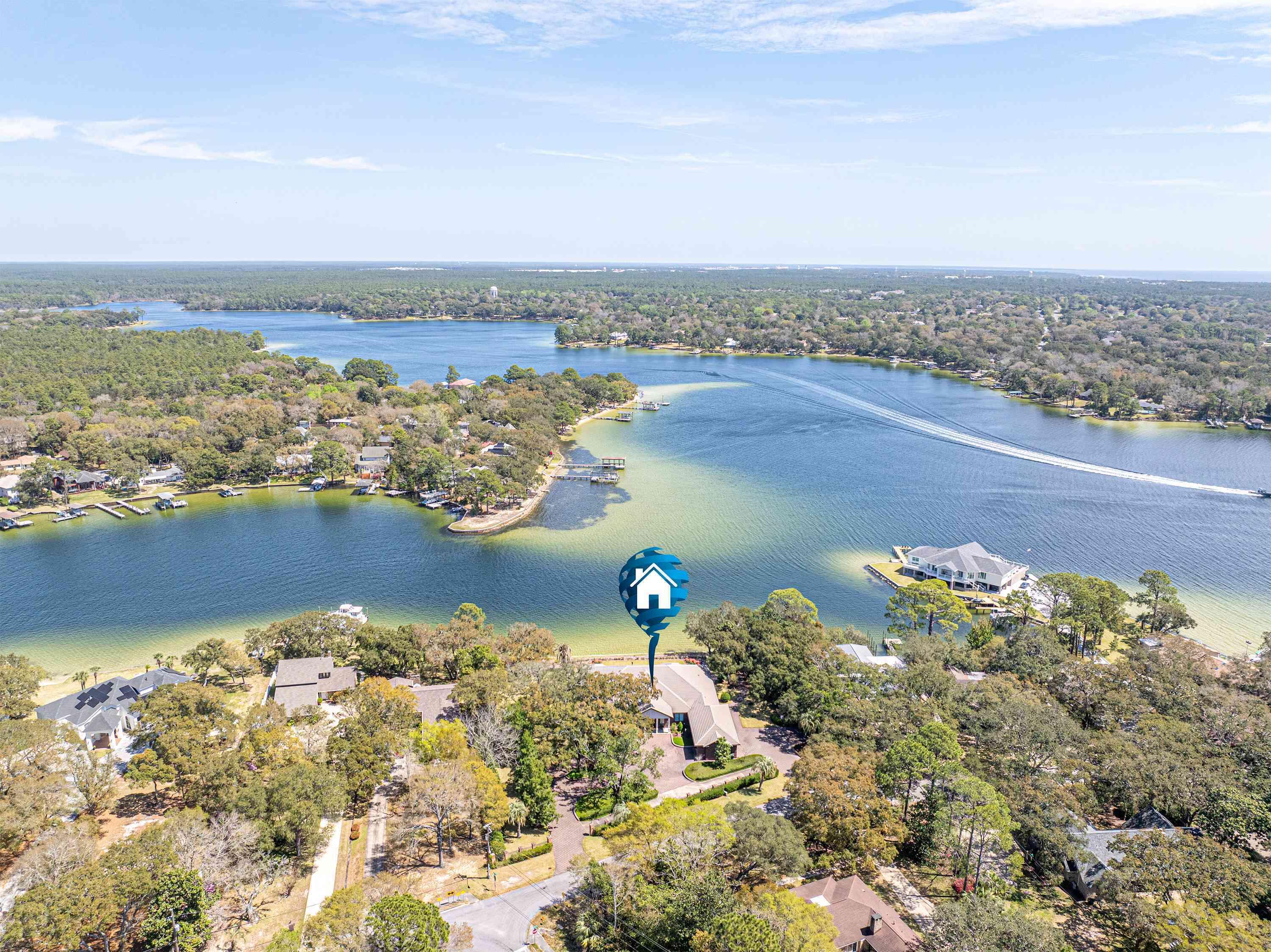 ***PRICED BELOW RECENT APPRAISAL! 
 Built in 2019.  Lower Insurance costs!  Sold mostly Furnished with Few Exclusions! ***  Live the Waterfront Dream in Fort Walton Beach!  This custom-built masterpiece offers 273 feet of pristine water frontage at the mouth of Chula Vista Bayou, providing direct boating access to Choctawhatchee Bay, the Intracoastal Waterway, and the Gulf.  Set on 1.35 acres, this property combines luxury, privacy, and exceptional craftsmanship. 
Designed with thoughtful details throughout, the home features gorgeous woodwork, a home generator, a secure safe room, three cozy fireplaces, and an extra washer and dryer conveniently located in the master closet.  Practical touches include 10-foot-wide garage doors and a spacious walk-in attic for all your storage needs. A built-in stereo system and a comprehensive security system add to the ease of living. Step outside and experience true tranquility. The expansive, covered patios, one off the living room and another off the kitchen, create a seamless flow for entertaining and offer breathtaking, vacation-like views. The outdoor spaces are exceptionally quiet and serene, making it feel like a private retreat. In fact, the stunning setting has been the backdrop for multiple weddings, a testament to its beauty and peaceful ambiance.  The large, lush yard leads to a private dock equipped with a water slide, perfect for endless fun on the water.  Inside, the home offers generous living spaces with 4 bedrooms, 4.5 baths, and multiple additional living areas. High ceilings, large windows, and an open, airy design bring in natural light and capture the beauty of the surroundings from every angle.  Whether you're hosting unforgettable gatherings or simply soaking in the quiet waterfront views, this home is a rare find. Is this your dream come true?
All dimensions and pertinent data to be verified by the buyer.