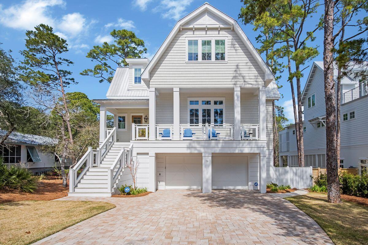 Tucked on a quiet, dead-end street and fully equipped with a fenced yard and pool sits this 2019 build in the Beach Highlands neighborhood with no HOA dues, just a few blocks to the neighborhood beach access. Marrying a farmhouse exterior with a fresh, contemporary interior, this four-bed, five-and-a-half-bath home is remarkable both indoors and out. The crown jewel of this home is the backyard oasis with alfresco dining area, low-maintenance turf, heated pool, outdoor shower, and dual-level porches and balconies overlooking it all. The first floor encompasses a generous and open living area, dining space and upgraded kitchen with 12-ft. ceilings, hardwood floors and quartz countertops. The owner's suite features an en suite tiled bath with both tub and shower, dual vanities, custom cabinetry and ample walk-in closet. The second floor has a second living area, three additional bedrooms with en suite baths and a bunk room with built-in sleeping accommodations. A utility room offers flex space for a variety of uses. Storage is plentiful, from the two-car garage with custom shelving to a sizable walk-in pantry to covered space beneath the home. A hidden laundry room off the kitchen offers convenience. This home was designed to add an elevator if desired. Beach Highlands is conveniently located just off Scenic Highway 30A with both neighborhood beach access and regional beach access that includes plenty of parking, bathrooms and lifeguards on duty. Easily navigate to the shops, restaurants and attractions that make 30A a world-class destination for so many.