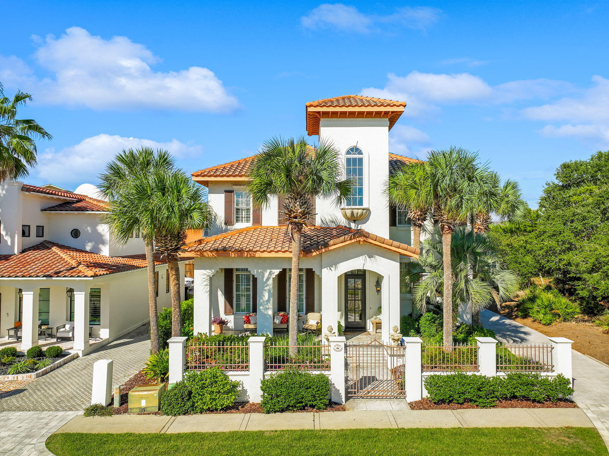 Welcome to Caribe, a hidden gem in Miramar Beach where serenity meets the beauty of the Emerald Coast. This exclusive community offers a perfect retreat for those who value privacy and luxury. Caribe is a close-knit neighborhood where families have enjoyed paradise for generations. With a blend of tranquility and Caribbean charm, you can stroll quiet streets, relax by two resort-style pools, or enjoy tennis and pickleball. One of the community's highlights is private, just a short walk away, complete with chair and umbrella service for nine months of the year.

Conveniently located near Sandestin Resort and top shopping, dining, and entertainment options, Caribe is close to all that Miramar Beach has to offer. Now, let's explore this remarkable property. This elegant home boasts over 3,400 square feet, facing a serene pond with no neighbors directly in front. Inside, a grand staircase and soaring ceilings create an airy ambiance. The open floor plan connects the living and dining areas, featuring natural wood textures and a cozy fireplace.

The chef's kitchen includes custom cabinetry, pristine countertops, and high-end appliances, with a butler's pantry and coffee bar for convenience. A laundry area and compact office add practicality. The main floor master suite offers a spa-like ensuite with a soaking tub and walk-in shower. Upstairs, there's a second master suite and two spacious bedrooms with a Jack-and-Jill bathroom. Outdoor living features expansive patios, perfect for relaxation, along with ample parking and storage. With 24-hour security and amenities, Caribe ensures luxury and peace of mind. This home is also a fantastic investment, with projected rental revenue exceeding $140,000 annually!
