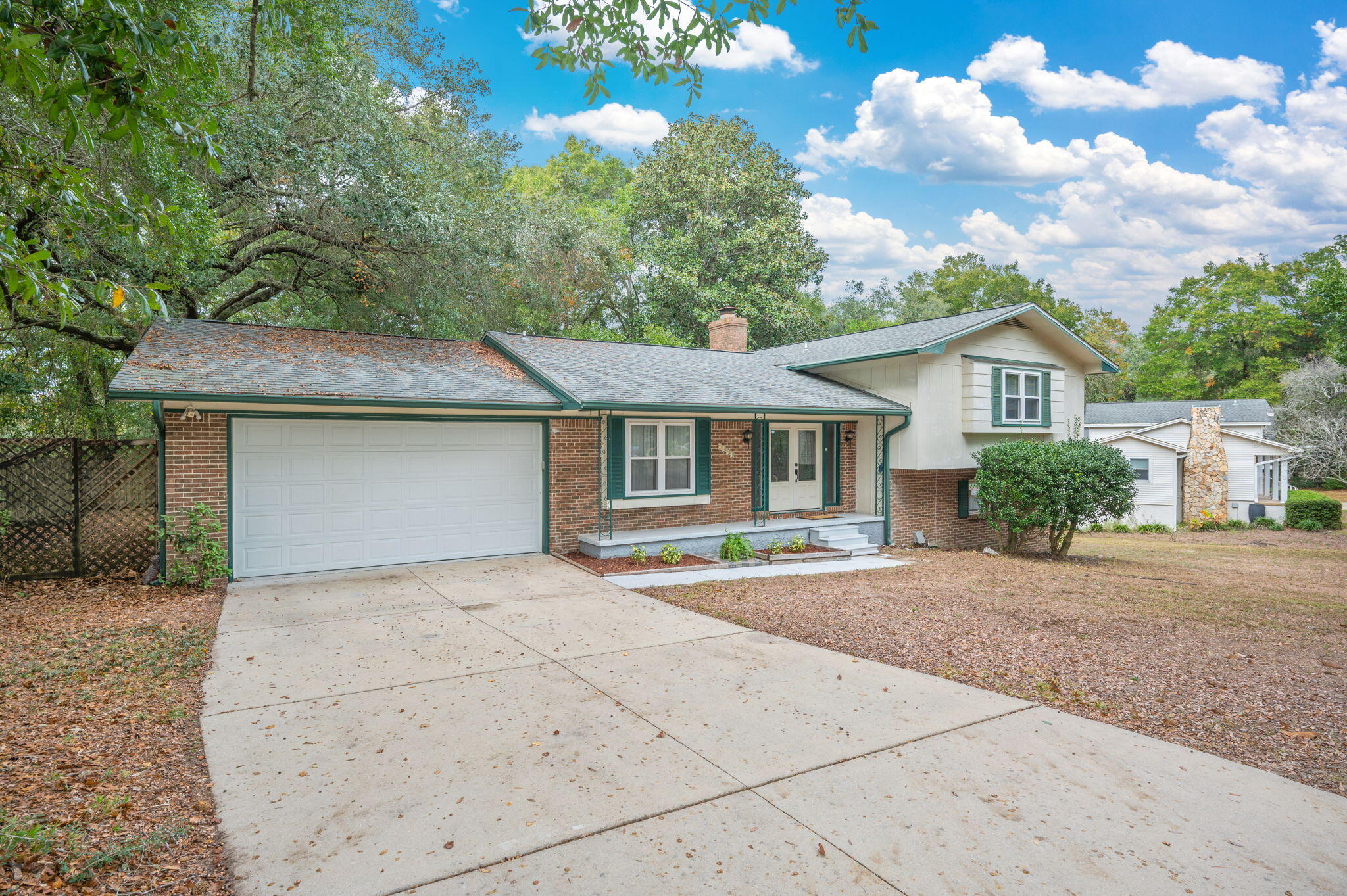 Welcome to this spacious and inviting split-level home in the heart of Niceville! With 4 bedrooms and 3 full baths, this property offers generous living spaces and flexible layout options perfect for a variety of lifestyles. The main floor features a warm, welcoming living room complete with a wood-burning fireplace, ideal for cozy evenings at home. A large kitchen with abundant cabinetry provides ample storage and workspace, while the adjacent dining room is perfect for family meals and entertaining.
On the lower level, you'll find a comfortable den with a gas stove for added warmth, a large bedroom, and a full bath—great for guests, multigenerational living, or a private home office suite.
The upper level hosts the spacious primary bedroom with an en-suite bath, along with two additional bedrooms and a full hall bathroom.
Step outside to an open, roomy backyard that's ready for outdoor fun and gardening. The impressive double-decker deck offers two levels of outdoor living, plenty of space for dining, grilling, and relaxing. The large shed provides even more storage for tools, toys, or hobbies. This unique home offers comfort, versatility, and plenty of room to grow, all in a desirable Niceville location. Roof, Water Heater, and HVAC all replaced within the last 5 years! Don't miss it!