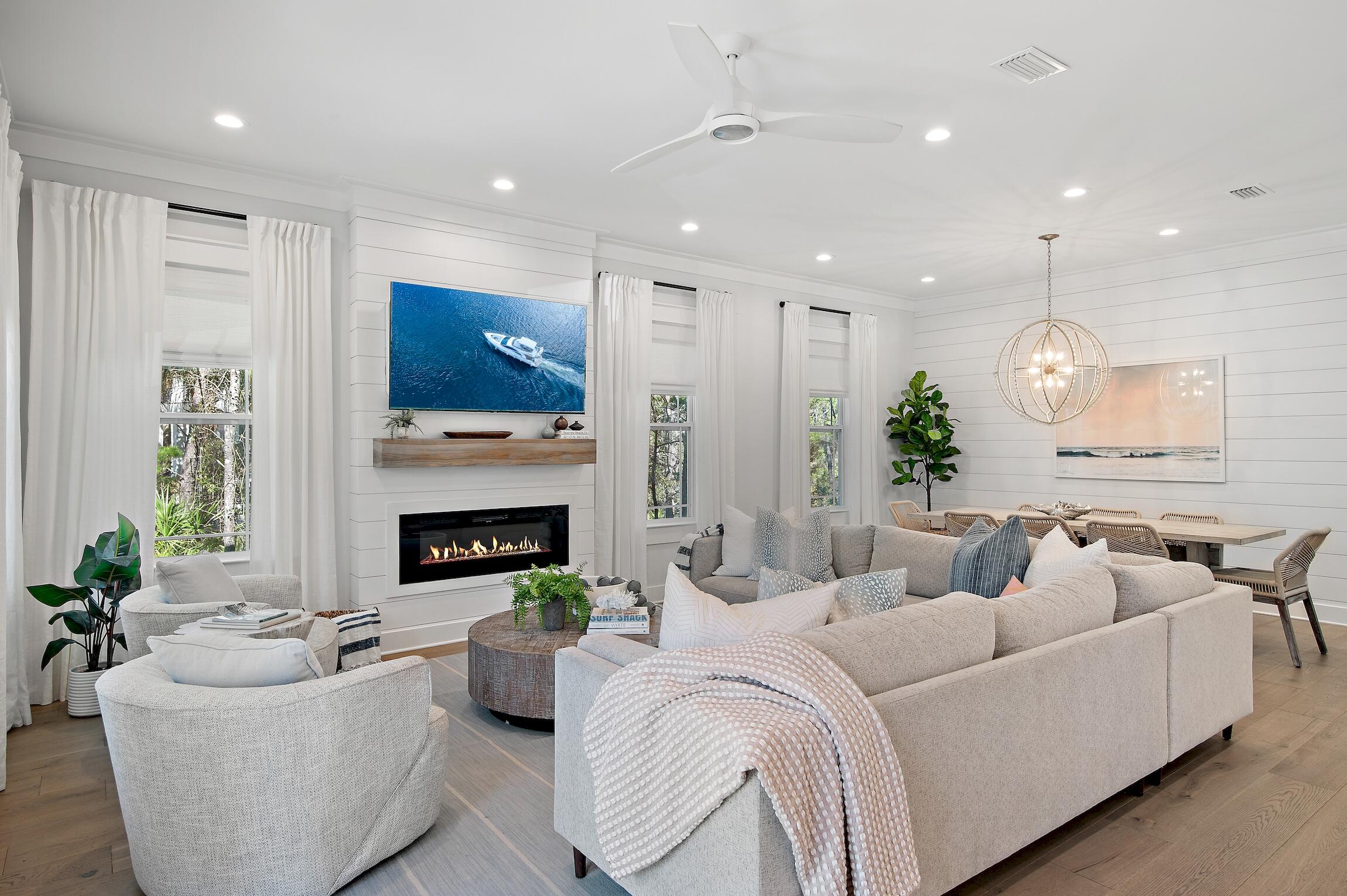 Introducing a remarkable 2021 constructed home, nestled in the highly sought-after Seacrest Beach neighborhood located between Alys and Rosemary Beaches.  This three-story home backs up to the nature preserve with outdoor living options on every level, offering serene spaces for reconnecting with friends and family or simply to relax amidst the peaceful surroundings.

Experience the stunning details of the custom interior and exterior designer selected finishes, epitomizing refined beach living. Upon entering the home is a charming and open living and dining room where you will find 10ft ceilings, stylish pendant lights, hardwood floors throughout, designer furniture, custom window treatments, and fireplace with a white oak wood mantle. The modern and light filled kitchen has plenty of counter space and features Calacatta Laza quartz countertops, 6ft island, stainless steel appliances, gas cooktop, and a wet bar including a wine fridge and ice maker. French doors open to the first level primary suite with its own porch and walk-in closet with wood shelving. The primary suite's bathroom features a double vanity, large glass walk-in tiled shower and free standing tub. Also on the ground floor is the laundry room and a separate half bathroom.

On the second level, indoor and outdoor living is a delight. Inside boasts an inviting second living area with a queen sleeper sofa and a lockable closet for additional storage. This level also accommodates three bedrooms including the beautifully decorated four-bed bunk room, one guest bedroom with a private en-suite bathroom and another guest bedroom with easy access to a separate full bathroom.  Rain or shine, unwind to the scenic views of the nature preserve on the large covered outdoor private space. Entertaining is made easy with ample cozy seating options including a large outdoor sectional couch, bistro table and chairs set and more.

The third floor is home to the second primary suite, designed to be harmonious blend of elegant and calming elements. Enjoy views of lush tree tops, starry skies, and blue sky days from the private porch.

This exceptional property also has a paved driveway space in front of the home with options to use it for private parking and as an additional space for a convenient outdoor grilling area. On the rear of the home is an enclosed outdoor shower and extra outdoor storage. This property offered fully-furnished is an incredible opportunity to be enjoyed as a primary residence, second home, or a vacation rental investment property. Rental projections include rental revenue up to  $130,000+ annually. Owners and guests can use the walking paths, bike, or the convenient neighborhood shuttle service to the community 12,000 square feet resort style lagoon pool and deeded beach access.