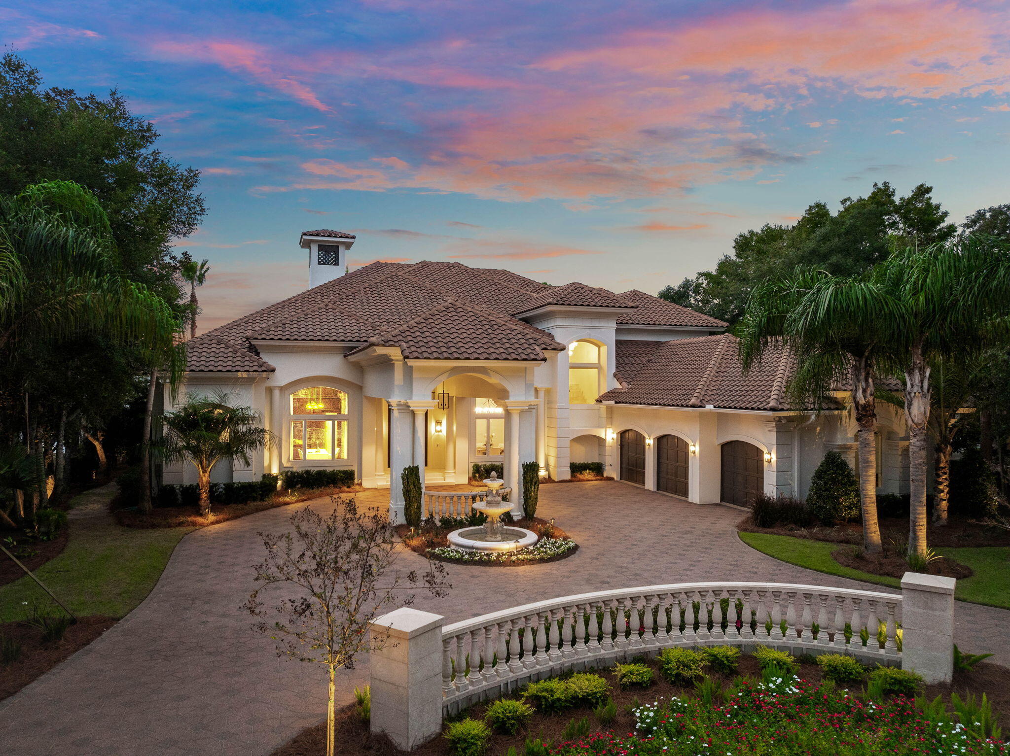 Finely appointed and beautifully remodeled with professional design by Duce & Co, this prestigious estate is located within the gates of Kelly Plantation and is the epitome of luxury living; the ultimate playground for water enthusiasts situated on 145 feet of majestic western facing bayou vistas featuring a newly built 80' state of the art deep water boat slip. Thoughtfully reimagined by Duce & Co, this regal residence boasts brilliant design details, an expansive open floor plan, and a custom-tailored dock featuring an 80-foot deep water boat slip with additional pontoon slip, as well as jet ski slips. With 145 feet of bayou frontage on wide, deep water, this home offers unparalleled access to Destin's vibrant waterways and the luckiest fishing village on earth! This rare opportunity combines elegance and functionality, situated on a lot graced with mature live oaks and magnolias, and newly installed tropical modern landscaping that accentuates its impressive architectural facade. From the moment of arrival, the stunning brick paver circular drive and porte-cochère set a tone of sophistication, leading to custom designed solid wood entry doors that open into a grand foyer with double height ceiling. Inside, the home's refined craftsmanship is immediately apparent, with soaring 23-foot ceilings in the living room, a dramatic newly minted solid marble fireplace, and an adjoining formal dining room perfect for hosting guests. The wood clad study/library exudes timeless charm with custom-built shelving.

The luxurious primary wing is a private retreat, featuring a spacious waterfront bedroom, two large walk-in closets, and a spa-inspired bath complete with a soaking tub, a large double vanity, a private water closet, and a walk-in shower. The heart of the home unfolds in the open concept living area, where a large casual dining space flows into the fully renovated chef's kitchen. The kitchen dazzles with custom cabinetry, gleaming stone countertops, an expansive breakfast bar, a walk-in pantry, and premium Viking appliances, including a gas cooktop and double dishwashers anchored in the oversized center island. Adjacent is the leisure room, where sliding glass pocket doors open at a 45-degree angle to seamlessly connect indoor and outdoor living.

Designed for entertaining and family living, the property includes two ensuite guest rooms on the main level, a generously sized laundry center, and a second-floor media room, complete with a 100" + big screen television and finely appointed luxury recliners. Upstairs, there are two additional ensuite bedrooms and a 12.5' x 29' heated and cooled storage room as well as a glass railed balcony for soaking in the bayou vistas at sunset. Throughout the home, exquisite touches abound, from deep crown molding and custom floors to designer lighting and thoughtful lighting detail & finishes, reflecting unparalleled attention to craft.

The outdoor living area is a private oasis, featuring a newly built summer kitchen, a massive resort style pool with a tranquil water feature, and a private dock equipped with boat slips and watercraft lifts. Designed to accommodate a large 80' vessel, the dock provides seamless access to the open bay just three lots away, making it a short ride to Crab Island, Destin Harbor, and the Gulf of Mexico.
For peace of mind, the property includes a generator access. Fully renovated, this home is a true masterpiece offering waterfront living at its finest.

If you're seeking an unparalleled combination of elegance, functionality, and access to world-class boating, golfing, white sand beaches as well as the world class restaurants and shopping nearby, this Kelly Plantation residence is your ultimate destination.

Reach out to us today for more information.
