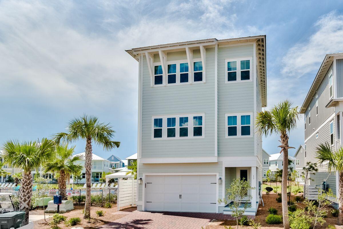 Put yourself in the middle of the action in this three-story home with gulf views next to the Prominence South pool and a short distance of The Hub. Featuring four beds, three-and-a-half baths and 3,550 square feet of living space, this home boasts a two-car garage at the end of a brick paver driveway and a private elevator that opens to all three floors for easy accessibility. 

The first floor is home to a suite that functions as either a bedroom or second living room with access to one of three outdoor living areas. The second floor is the hub for daily living with a great room, chef's kitchen, laundry room and more balcony space. The third floor features an owner's suite and two additional guest bedrooms. Notable features throughout include a sizable bunk room to boost sleeping accommodations to 12, wire-brushed hardwood floors, granite countertops, stainless appliances, white painted cabinetry, shiplap accents, crown molding, 10-ft. ceilings, hurricane impact windows and a tankless water heater. 

This retreat, ideal as a vacation home, backs up to green space, which can be enjoyed from multiple levels of outdoor decks and patios on each floor. Situated between Seagrove and Alys Beach on Scenic Highway 30A, a home in Prominence South includes access to two community pools and a fitness center and nearby proximity to The Hub's restaurants, shops and amphitheater with a covered event pavilion.