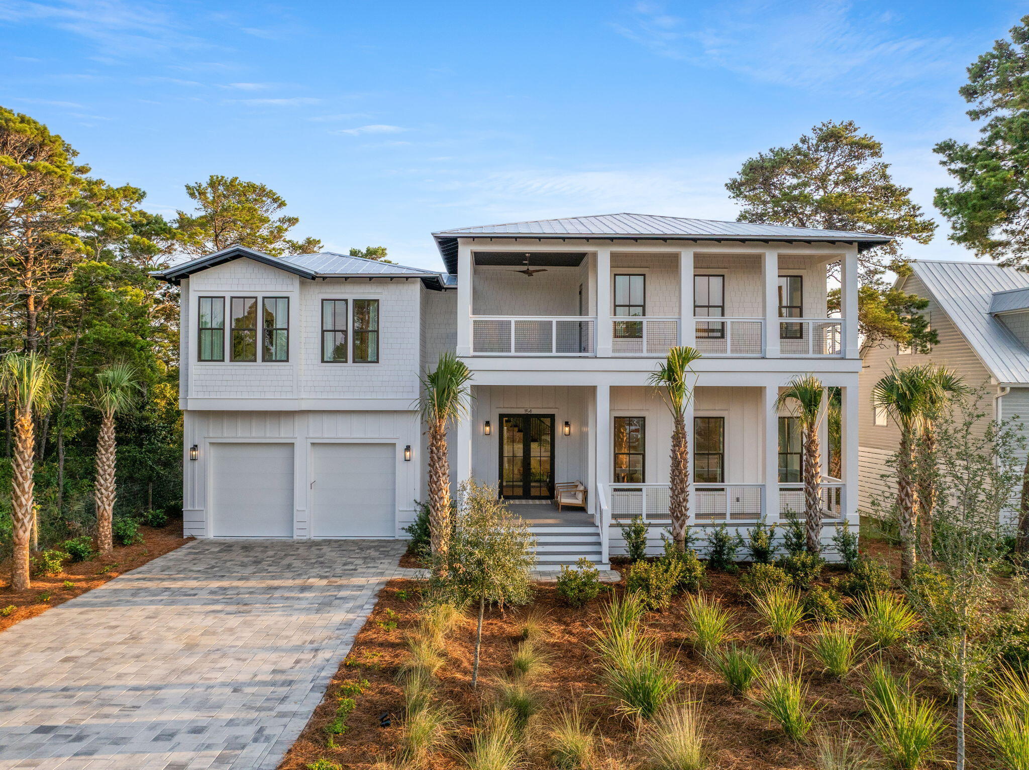 Welcome to luxurious living at 154 Maple St, located in the serene Santa Rosa Beach, FL. This stunning single-family home offers 4,340 square feet of sophisticated design and high-end finishes. With six bedrooms and six and a half bathrooms, this detached luxury house provides ample space for relaxation and entertainment. This exceptional new construction home is just four minutes from the Gulfview Heights Beach Access and equally close to the 15,000 acre Point Washington State Forest with 27 miles of scenic trails.

Step inside to discover an open kitchen that is a chef's dream, featuring premium counters, stainless steel appliances, a gas stove, range, range hood, and a convenient island. The pantry, dishwasher, freezer, and refrigerator ensure all your culinary needs are met. The living areas showcase elegant hardwood and tile floors, complemented by the soft glow of recessed lighting and the sparkle of chandeliers.

Comfort and style extend to the bedrooms, equipped with custom and walk-in closets. The cozy ambiance of a fireplace warms the spacious living room, while window treatments add a touch of elegance throughout the home. An attic provides additional space for storage or creative use.

Outside, a private oasis awaits you with a heated pool, hot tub, spa, and private pool area. Enjoy the tranquil setting from the balcony, private patio, or in the beautifully landscaped private yard. The outdoor features include a barbecue area, deck, front and back yards, outdoor shower, and porch, all enhanced by smart irrigation and generous storage options.

This home also includes a laundry room with a washer and dryer, and private storage to suit your needs. Experience the epitome of luxury living at 154 Maple St.