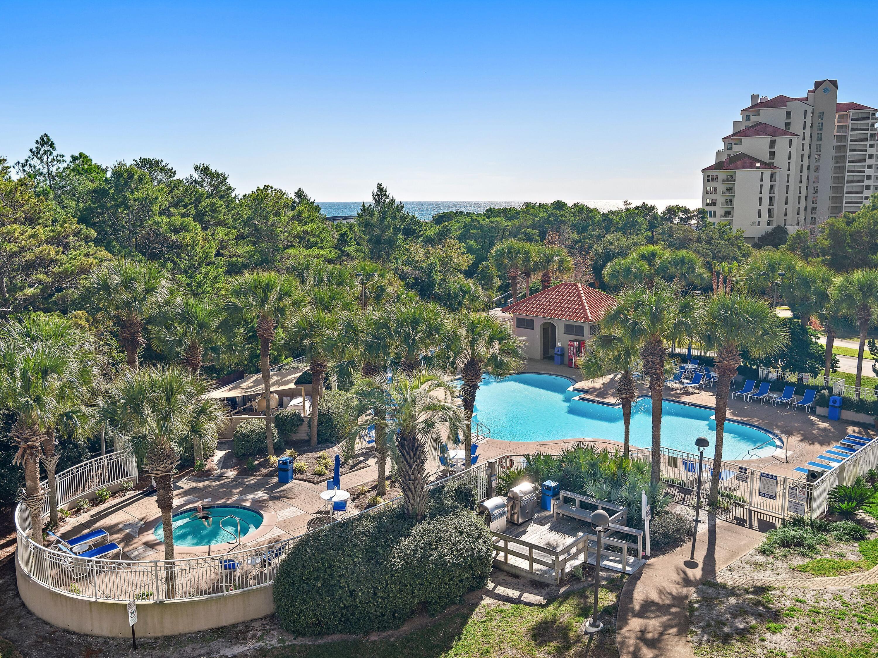 Discover The Summit at Tops'l, perched on a 34-foot bluff that provides breathtaking views of the stunning 52-acre gated Gulf-front community of Tops'l Beach and Racquet Resort. Located on the 4th floor, this unit faces east, where you can enjoy views of historic Four Mile Village, Coffeen Nature Preserve, and the Gulf of Mexico. Step inside and be greeted by 9-foot ceilings that enhance its open floor plan. The living room, adorned with a sliding glass door and windows, floods the space with natural light, creating an inviting atmosphere for relaxation and entertainment. The master suite is a true retreat, boasting a luxurious private bathroom equipped with a spacious walk-in shower, a double vanity for added convenience, and a large jetted bathtub perfect for unwinding after a long day. This unit isn't just a fantastic second home; it's also an exceptional vacation rental opportunity! Thoughtfully decorated and featuring attractive flooring throughout the unit, it exudes elegance and comfort.

Versatility is key with its clever lock-out designthis space can be rented out as a full three-bedroom unit or conveniently separated into one and two-bedroom components, offering flexibility for your rental needs. Tops'l Beach and Racquet Resort is a haven for those who crave world-class amenities, showcasing an impressive 600 feet of pristine beachfront, a comprehensive fitness club with 12 Rubico tennis courts, expert on-site tennis pros, racquetball, invigorating aerobics classes, soothing on-site massage therapy, inviting swimming pools, steam and sauna rooms, and a luxurious whirlpool. Enjoy the added peace of mind provided by gated entry and security, not to mention the convenience of an on-site bar and restaurant to make every day feel like a vacation.
