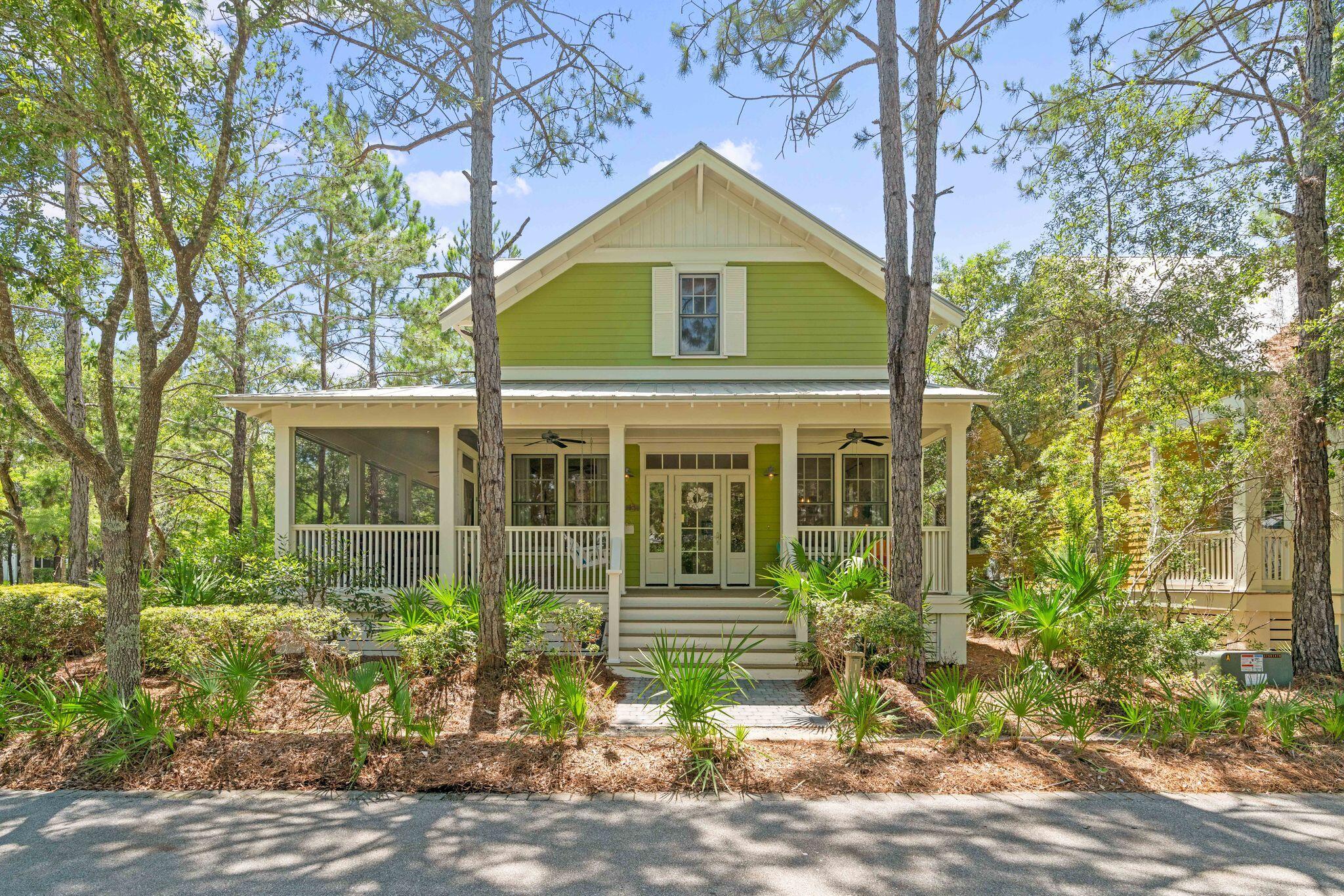 This 5 bedroom Beach House is tucked away on a corner lot in phase 3 of Watercolor.  The home has a large wrap around porch which is partially screened to enjoy summer days after a day at the beach or pool! The home offers an open floor plan allowing for great family time and entertaining.  The home offers wood flooring throughout and white shiplap walls. The kitchen offers a center island, kitchen aid stainless steel appliances to include refrigerator with icemaker, gas range, exhaust hood, dishwasher and microwave, an abundance of both counter and cupboard space and overhead transom cabinets that adorn the breakfast bar.  Decorative beach color backsplash fits perfectly in this Watercolor beach house.  This home offers the must have large pantry with wooden shelving.  Just down the hall is a very practical utility room complete with washer, dryer, utility sink and shelving. This home has a first floor master bedroom beautifully done with a whitewashed shiplap accent wall, large closet and a master bath with transom windows making it so light and bright! The bath offers a double vanity, garden bathtub with a beautiful shell chandelier, stand alone shower and water closet. A bunkroom and full bath complete the first floor. The second floor offers a large hall closet and two additional bedrooms.  One has an ensuite and one has a bonus bunk area with a full bath just across the hall. This property has a two car garage with a spacious carriage house above with a separate entrance. The carriage house not only has an oversized bedroom area, but a kitchenette area with a mini frig and a sink. A gorgeous white barn door slides open to the large bathroom with wall cubbies and a stand alone shower.  The perfect mother in law suite! The back porch of the home has a large storage closet and steps down to a large paver patio courtyard with an outdoor fireplace, grilling/kitchen area, al fresco dining and is covered by a beautiful white pergola. Tall Timber Court is a loop off of Pine Needle way with a large grassy area in the center great for a game of catch with the children!  The WaterColor community includes residential homes and an award-winning beach side resort located on the beautiful Gulf of Mexico beaches and alongside serene Western Lake. The community is designed to have a small-town feel and is perfect for exploring on foot or by bike. Quaint streets and pathways connect homes to the community's parks, lush green spaces and shops. The community includes access to a boathouse with paddle boards, kayaks and fishing equipment; an outdoor amphitheater; a lakeside pool; a bike barn and more. Residents also have access Watercolor's state-of-the-art tennis center, including a stadium court surrounded by a grass-stepped terrace and native landscaping, five Har-Tru HydroCourt clay tennis courts and a pro shop with tennis gear. Private lessons, group clinics and other activities are available throughout the year. Call to schedule a showing of the beautiful Watercolor home today!