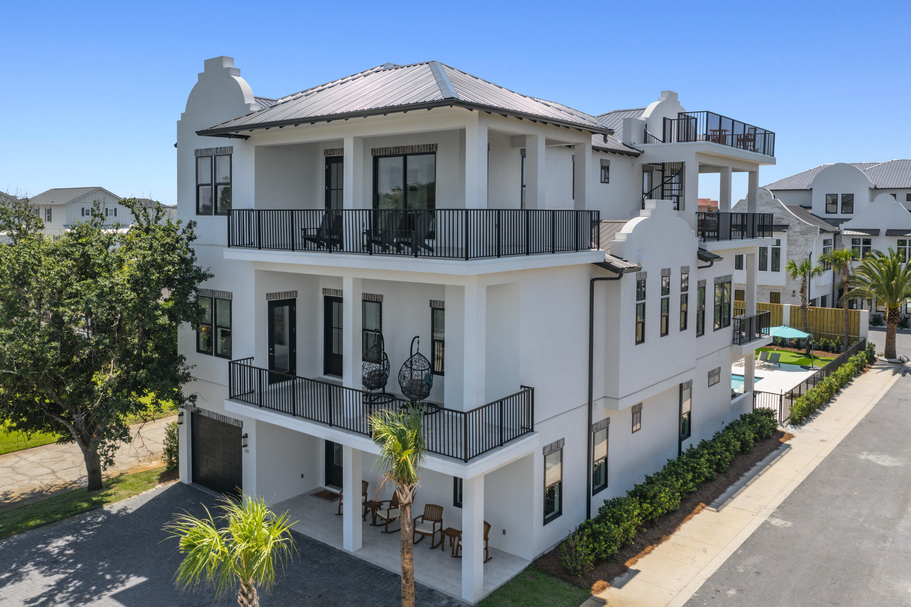 NEW FULLY FURNISHED AND TURN KEY RENTAL WITH 423K in bookings! A professionally designed turnkey rental opportunity unlike any other on the coast! Every detail has been thought of for the savvy investor to just take over. Seller will manage for 1 yr at 5%. Perched just blocks away, this home offers a front-row seat to one of nature's most breathtaking spectacles - the Gulf view. This 5800+ SQ FT luxury home is a testament to the art of coastal renting. Embrace the tranquil beauty of the Gulf and make this piece of coastal paradise your own. The backyard features a heated pool/spa, putting green, and gas grill.  Step inside to find an entertainment room including games and pool table, work out room, and 8 ensuites, plus a bunk room. All furnishings and golf cart convey. Don't miss out! This custom-built home showcases the finest craftsmanship and attention to detail, with soaring ceilings, exquisite finishes, and an open-concept design that allows natural light to flood every corner. The gourmet kitchen is a chef's delight, boasting high-end appliances, quartz countertops, and a center island that beckons for gatherings. A private backyard oasis features a heated pool, a spa, and lush landscaping, creating a serene retreat for relaxation and entertainment for guests.