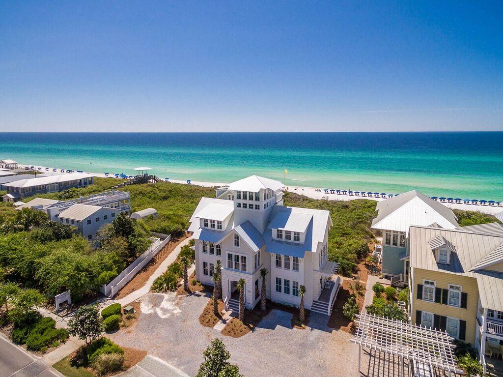 Exquisite, one-of-a-kind WaterColor home located south of Scenic Highway 30A! Designed by Stackable + Squires, developed by Cummings Development and built by Daniel Cole, this incredible coastal retreat features a reverse floor plan with an elevator to maximize enjoyment of Gulf views. Home has an enclosed heated saltwater swimming pool and a 4th floor cupola with breathtaking panoramic Gulf and community views! Designed to comfortably host large groups with 4,478 square feet, 5 bedrooms, 5.5 bathrooms and spacious living and media rooms. Special finishes such as wire brushed stained oak hardwood floors and 8'' v grove walls add character and charm with top end fit and finish throughout! There is a vacant lot in front of the home that can be built upon, however, there are major restrictions as to what can be built and the placement of the home. A pattern book showing the maximum height and footprint is available upon request. Even with a structure placed on the vacant Gulf lot, you'll always have incredible Gulf views throughout the home, making this one of the best purchases South of 30A!