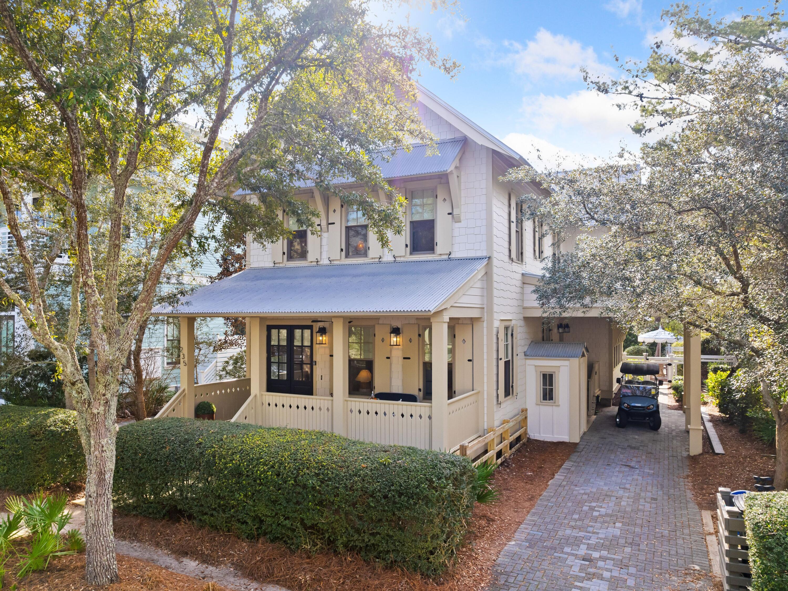 Sophisticated charm and private indulgence define the coastal palette of this bright and beautiful beach cottage nestled on the quietest of streets in the heart of WaterColor's highly-coveted Phase III. With more than 2,500 square feet of living space, this four-bedroom, four-bath coastal retreat overlooks a nature preserve and affords owners ultimate privacy and serenity with an effortless walk over the bridge to the town center and beaches of WaterColor. The stunning interior of this upscale beach cottage is thoughtfully curated with exceptional finishes from Serena & Lily, Cailini Coastal, and Beau Interiors including original artworks, vintage collectibles, one-of-a-kind antique selections, gorgeous custom rugs, and even a new custom-built back porch swing. Discerning buyers will appreciate further practical enhancements including the new dishwasher, washer/dryer, hot water heater, custom lighting, modern ceiling fans, refinished decking, and interior and exterior paint, giving the entire property a fresh makeover from the inside out. 

Aesthetically pleasing fine touches begin upon entry to the first level with the entryway antique wabi-sabi console table and continue through the spacious open family room dressed with Serena & Lily furniture and accessories that create the perfect palette for entertaining. The eye-catching shell fireplace creates an irresistible focal point while luxury furniture from Beau Interiors invites indulgence and relaxation with a favorite movie or novel. The well-appointed gourmet kitchen features high-end stainless-steel appliances, Sub-Zero refrigerator, gas range, a beautiful custom tile backsplash, gorgeous quartz countertops, and a roomy island for prep and added seating. The dining table creates a spacious spot for memorable celebrations and friendly family board game matches. The guest space on this level features a king bed, shared bathroom with custom armoires. The refined and relaxed feel continues through the guest spaces on the second level. There are two king suites each with a private ensuite, and a guest suite featuring two full beds and twin Nico & Yeye trundle beds and a chest of drawers. This space also has a private bath. All bathroom fixtures, sinks and toilets have been completely updated.

In juxtaposition to its high-end finishes, Scrub Oak retains a laid-back beachy ambiance. Two large screened porches overlook the stunning secluded pool with luscious landscaping and exquisite Serena & Lily furnishings. The view continues seamlessly to the shady green space beyond the back gate. The front porch is 150 yards from the famous Frog Pool--the kid's favorite space. Youngsters can safely ride bikes around this neighborhood in the Lake District or walk the peaceful nature trails and boardwalks. 
 
Wise investors will note the large laundry room, dedicated parking spots, abundant storage, and two owners' closets thoughtfully integrated with future rentals in mind. All furnishings will convey along with a propane grill and a new handy six-seat golf cart for adventuring nearby. Buyers desiring the ultimate in vacation services will appreciate this home's proximity to WaterColor's amenities and the beach. Guests of WaterColor enjoy access to the newly expanded WaterColor Beach Club, featuring a new main pool and lounge area, a second pool deck with additional lounge seating, and a third pool with zero-entry, an enhanced WaterColor Grill, and a new sunset bar Costa Chica. All have scenic views of the Gulf of Mexico. One of the newer communities along Florida's idyllic 30A, WaterColor has a prime waterfront spot on the gulf and a plethora of activities to entertain beachgoers of all ages. Tucked between Seaside, Florida, and Grayton Beach State Park in South Walton, this neighborhood of charming homes and tree-shaded lanes is on the rise.