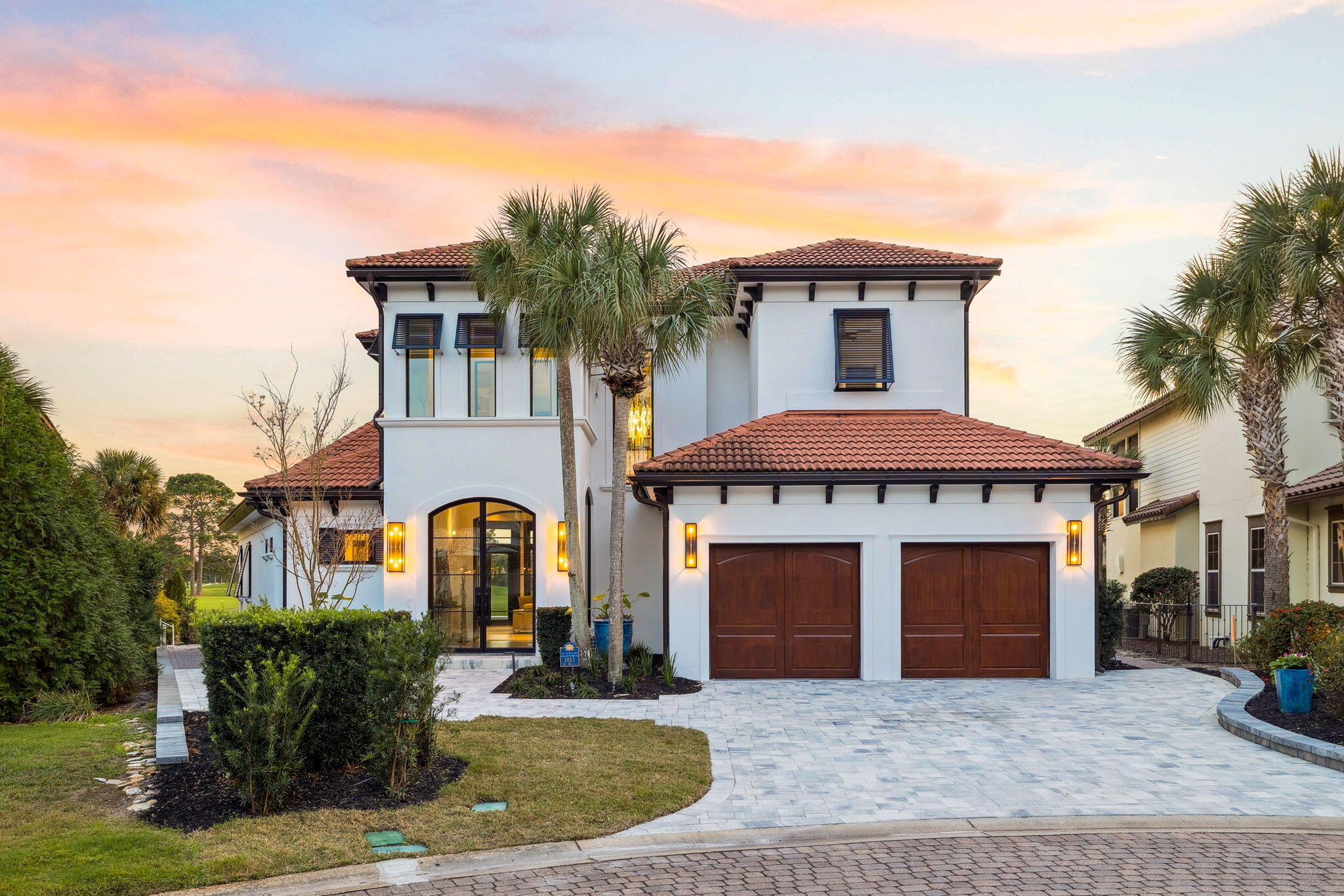 Experience Sandestin at its finest in this beautifully reimagined coastal retreat, set on one of the most spectacular lake and golf course vistas in all of the resort. Thoughtfully renovated from top to bottom, this home blends high-end design, modern comforts, and effortless livability, set within the serene, rental-restricted enclave of Del Mar. With a front-row lakeside seat to the number four fairway of the Baytowne Golf Course and sweeping views that stretch across holes two, three, and beyond, this private oasis offers a rare combination of beauty, tranquility, and convenience, just a quick golf cart ride from the world's most beautiful beaches, Grand Boulevard, Baytowne Wharf, dining, shopping, and everyday essentials.

A newly added entry foyer with soaring ceilings welcomes you home and immediately sets the tone for the elevated finishes found throughout. Step inside to an open, light-filled living space anchored by brand-new floor-to-ceiling ten-by-twelve Euro doors that fully accordion open, creating a seamless indoor and outdoor connection and framing postcard-worthy views of the pool, lake, and golf course beyond. Petrified wood porcelain tile floors flow throughout this space, providing a sophisticated foundation for the home's serene palette of blues, golds, and natural tones.

The main area of the home unfolds in an open-concept design that beautifully integrates the kitchen, living room, and dining or flex space. The chef-inspired kitchen blends innovation with artistry. High-end Thermador appliances, including a gas range with griddle and separate fridge and freezer towers, deliver professional-grade performance while paneled appliances and accordion counter-top cabinets maintain a sleek aesthetic. Striking blue marine granite counters, complemented by golden finishes and an intricate backsplash, create a refined coastal sensibility. Additional features include a large pantry with wine fridge, generous storage with thoughtful solutions such as hidden under-island cabinetry, and exquisite Italian chandeliers that elevate the space with graceful sophistication.

The living room is designed as a refined retreat, offering a comfortable place to gather, relax, and admire the sweeping views that define this home. It's a space equally suited for lively entertaining or peaceful moments at home, with an ambiance that feels both elevated and effortless. A chic wet bar with beverage drawers adds convenience and elegance, while the extended rear addition provides a flexible space for lounging, dining, or simply relaxing in the glow of natural light.

The outdoor living spaces are equally impressive, designed as a private sanctuary for relaxation, recreation, and entertaining. A heated pool is set against the backdrop of the expansive golf course and lake views, inviting leisurely afternoons in the sun or a moonlit swim. New shell stone tile, fresh landscaping, a new dock, and a recently installed seawall complete the space. Ample room for outdoor dining and lounging makes it easy to savor our beautiful Florida weather, whether sharing a meal al fresco or simply unwinding under the open sky. From hosting a lively evening to enjoying a quiet sunrise coffee, this setting embraces the best of coastal living.

The expansive primary suite is a peaceful sanctuary tucked away on the main level. Sweeping windows frame the view and are fitted with electronic blinds to instantly transform the room from sun-drenched to full blackout. The spa-inspired en suite bath exudes luxury with a quartzite soaking tub featuring integrated under-lighting, an oversized steam shower, custom cabinetry, and hidden storage elements that balance beauty with function. His-and-hers walk-in closets add to the suite's sense of ease, offering ample space and organization to support a relaxed and effortless daily routine.

Also on the main level is a flexible room that adapts gracefully to the rhythms of everyday life, whether as a guest bedroom, workspace, butler's pantry, or dining area. Adjacent to it, a newly redesigned full bath offers beautiful finishes and thoughtful functionality, enhancing convenience and comfort for both residents and guests.

Upstairs, two generously scaled guest suites each offer private en suite baths, walk-in closets, and refined finishes that mirror the home's elevated style. One suite enjoys a sweeping view over the golf course and added linen storage, while the other offers a spacious layout ideal for creating a personal retreat for guests or loved ones. Built-in bookshelves and cabinetry line the hallway, adding architectural character and practical storage. An additional flex space upstairs offers endless versatility as a sitting area, play space, studio, or office with an unbeatable view. Just beyond, a large balcony showcases one of the most impressive views in the resort, offering a peaceful perch for sunset gatherings, morning coffee, or simply unwinding while overlooking the fairways.

Back on the main level, a thoughtfully designed laundry room offers abundant custom cabinetry, built-in organization, and plenty of room to keep life running smoothly. The oversized two-car garage has been newly refinished with a beautiful and durable epoxy floor, upgraded silent garage doors, and additional storage enhancements that combine function with convenience.

Constructed with exterior poured concrete walls, the home provides energy efficiency and peace of mind, ensuring comfort for years to come. Every corner of this home reflects meticulous attention to quality and detail. Fresh exterior and interior paint, newly refinished mahogany interior doors, upgraded hardscaping and landscaping, brand new shell stone tile on the pool deck and balcony, the recently refinished pool, newly added antique bronze half-round aluminum gutters, and countless thoughtful touches throughout speak to both the craftsmanship and care put into this spectacular residence.

Set within Del Mar, one of Sandestin's most desirable rental-restricted communities, residents enjoy a peaceful residential environment that feels worlds away yet moments from resort amenities. This is a rare opportunity to own a fully renovated home with truly exceptional golf course views, modern luxury throughout, and the ideal Florida lifestyle at your fingertips, refined, relaxed, and effortlessly livable.

Sandestin residents enjoy abundant amenities, including 5-Star golf courses, tennis and pickleball, biking and hiking trails, a 210-slip full-service marina, and the vibrant Baytowne Wharf for dining, activities, and shopping. The ever-growing Grand Boulevard Town Center, featuring restaurants, retail shopping, Starbucks, a movie theater, and Publix Grocery, is a short golf-cart ride away.