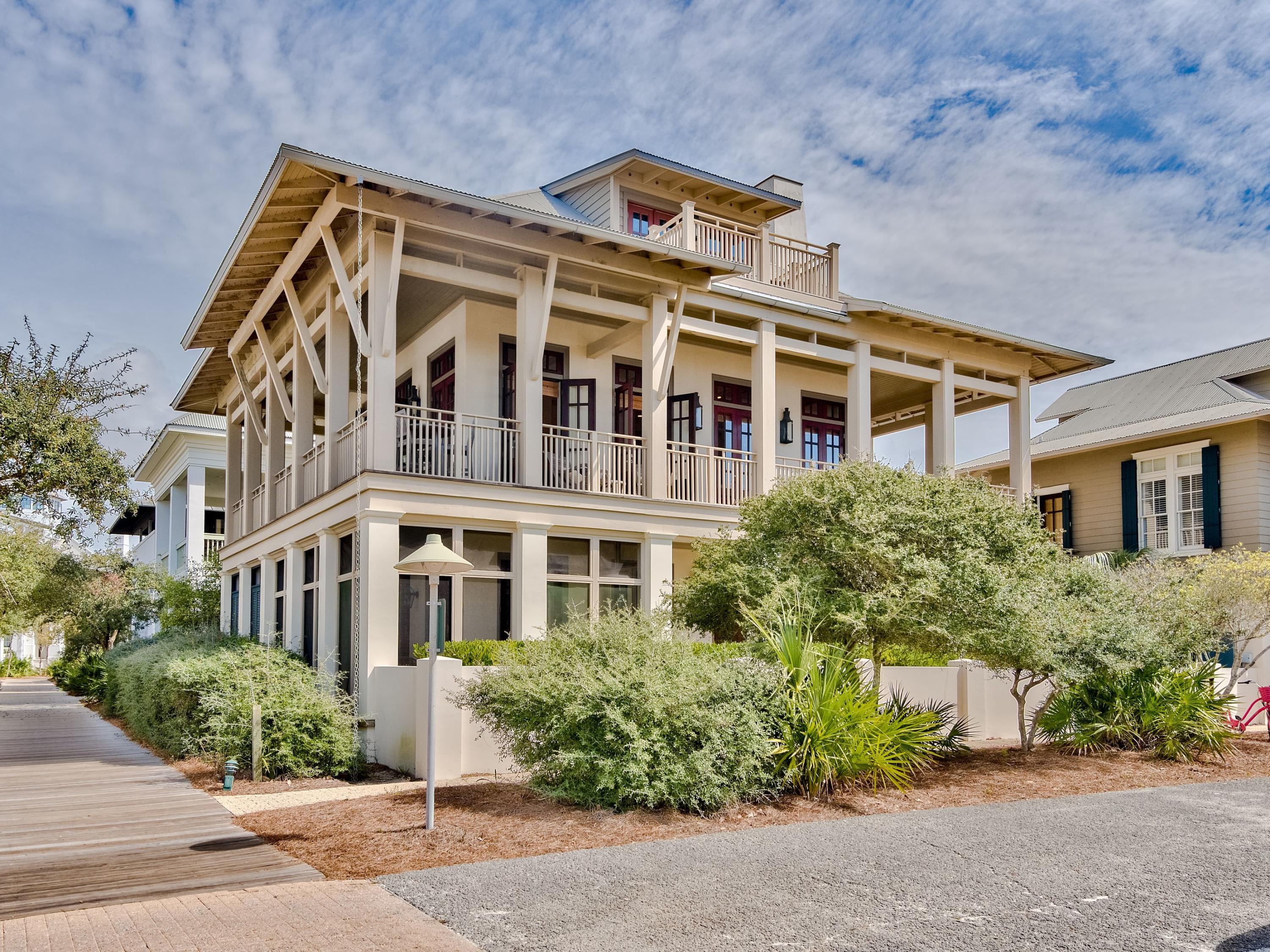 A preferred location with direct boardwalk access to the beach, this treasured Rosemary Beach house offers exceptional Gulf views. Tom Christ, of Christ and Associates, designed a main and carriage house with expansive balconies and porches enjoyed from copious French doors. The three level main house hosts the master suite on Level one with two guest bedrooms and ensuite baths. The second level presents the open living, dining and kitchen plus an adjacent media or game room and full bath. Arranged on the third level is a guest bedroom with ensuite bath. The carriage house provides an autonomous accommodation for guests with their own living and dining, kitchen, bath and lofted bedroom. The Rosemary Beach Town Center is only a block away with the plethora of shops and restaurants for great choices in entertainment. Other amenities of the Town include four pools, spacious parks, an amphitheater, owner's exclusive pool and an old world Town Hall on the Square.