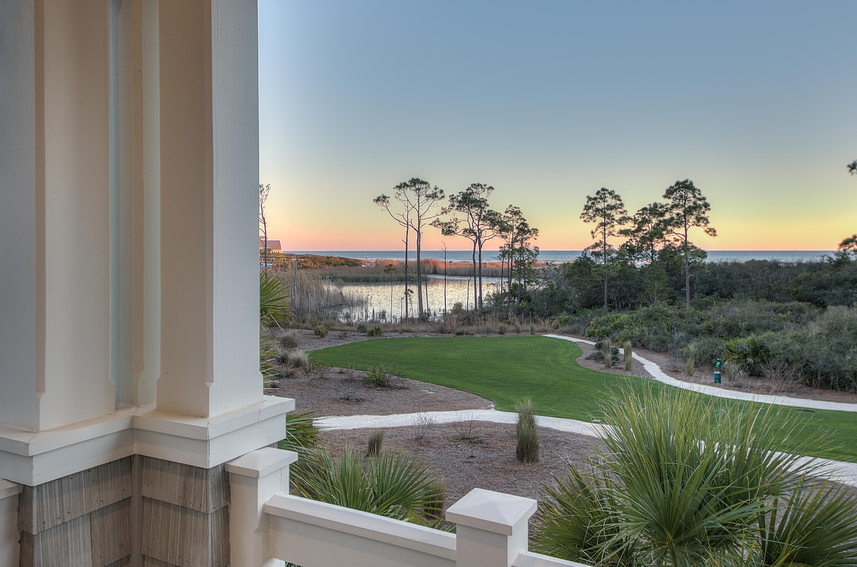 This Watersound Beach address radiates style, tranquility and exquisite taste. The soft hues of the impeccably decorated interior are accented with reclaimed oak hardwood floors, wrought iron stair case and chandeliers and a gorgeous, peaked and beamed cathedral ceiling in the dining area and living room. Perfect for entertaining, the large kitchen center island with gleaming Dacor stainless steel appliances make this an exquisite place to host family and friends. The expansive elegance of the great room concept raises the bar for amicable hospitality in stunning style. The home's delight only continues in its outdoor space, complete with large heated pool with fountains and copious room to relax in the sun. Take a break from swimming and enjoy a meal on the generous covered deck with dining and sitting area equipped with Dacor gas grill, refrigerator and ice maker. Enjoy spectacular views of the Gulf and coastal dune lake from one of the many balconies throughout the home. Step through a private court yard with calming water fountain and into a park area. On more than 250 acres of natural sand dunes, Watersound Beach residents enjoy a wonderful beach, bike paths and walkways, fine dining and a chic lifestyle that spotlights relaxation with a spirit of adventure.