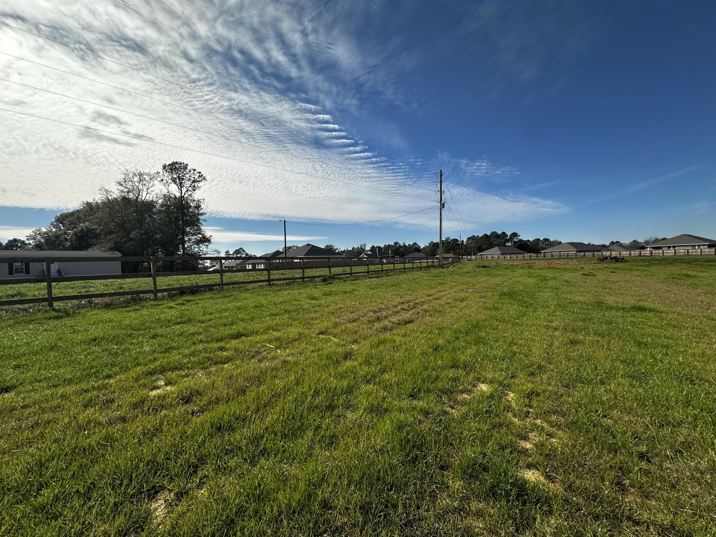 Approx. 3 Acres with Paved Road Frontage on Charlie Day Road in Baker!
This parcel is ready for your plans. With easy access to Hwy 90 and Hwy 4, and the new I-10 connector now under construction, the location offers added convenience for east-west travel across the Panhandle. It's a short drive to area beaches, local schools, military installations, and shopping -- including the rapidly developing area.