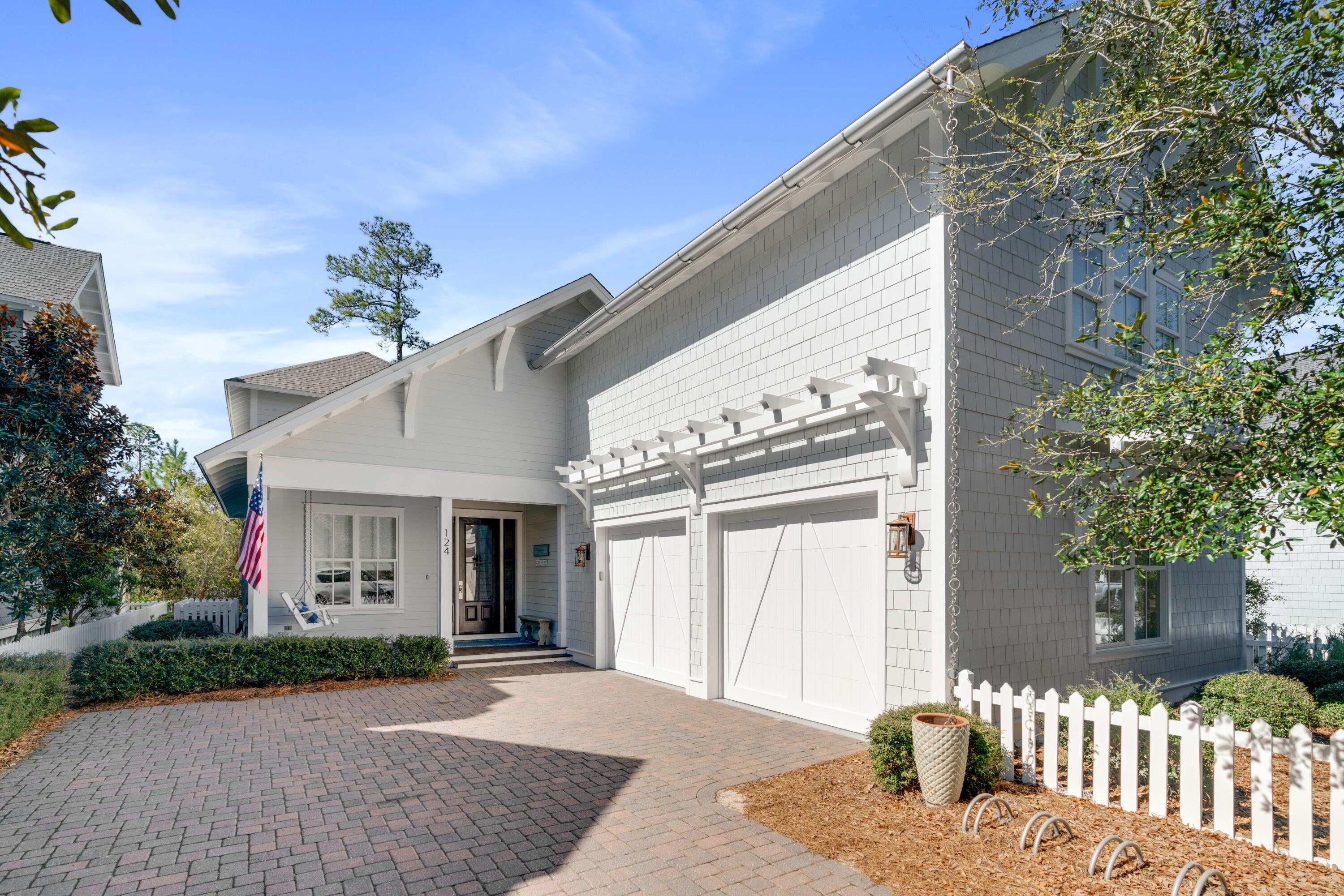 Experience the luxury of being south of 30A in this Nantucket-inspired home within WaterSound. A true coastal retreat with modern elegances can be found in this 5 bedroom, 5.5 bath home that is skillfully-designed with exquisite attention to detail. Whether you're looking for a private retreat or a home for entertainment, the privacy this home offers along the lakeside is unmatched. The oversized screened porches span the entire length of the home on the main level and the upper level, as well, taking full advantage of the lush natural landscaping and views. Entertain outdoors with your summer kitchen including a gas grill with custom hood or take in the sea breezes and serenity as you relax outdoors lakeside on the swinging beds and cozy furnishings Complete with hardwood flooring, custom woodwork, crown molding, tongue and groove walls and a gas fireplace with built-in bench seating, no detail was overlooked in this beachside masterpiece. A convenient, main level master suite becomes a true sanctuary with a separate sitting room, spacious bath to include a clawfoot tub and a large shower along with French doors to the screened porch to enjoy the peaceful lakeside views. Three additional bedrooms on the upper level offer guests their own private hideaway with all ensuites and two bedrooms with screened porch access. A spacious loft on the upper level is perfect for an additional living area that guests can enjoy when visiting the beach. The carriage house is access by a second staircase within the main home and provides vaulted ceilings, a kitchenette, living area, bathroom, large closets and the privacy your guests desire but still being connected.

WaterSound West Beach offers an incredible community pool and clubhouse with private beach access, to include access to all WaterSound Beach amenities within the main gates of WaterSound. This highly sought-after gated community is perfectly positioned adjacent to Deer Lake State Park and between The Hub and Seagrove making it ideal for a secondary home, investment rental property or a primary residence.