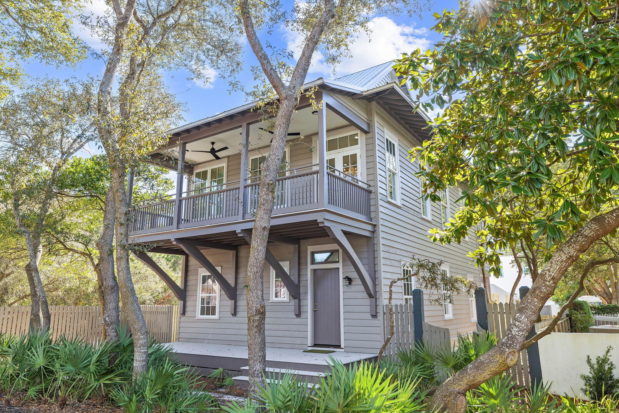 Located on the coveted south side of the Rosemary Beach community, this fully remodeled home masterfully blends coastal elegance with modern functionality. Designed by acclaimed architect Robert Orr, the residence reflects the timeless European colonial architecture of the Dutch West Indies, with its elevated masonry foundation, deep porches, and lofty ceilings. 

The main house offers 4 bedrooms, 4.5 bathrooms, and a bunk room providing plenty of space for family and guests. The inviting front porch leads to a thoughtfully designed first floor featuring two-bedroom suites, a charming enclosed bunk area, and stunning wood flooring throughout. The second floor boasts an open-concept living area and kitchen, seamlessly blending functionality and style, alongside an additional bedroom suite with an en-suite bathroom and private balcony overlooking the lush park behind the property.

The third floor, accessed by a spiral staircase, is a private retreat dedicated to a luxurious guest suite. Adding to the property's appeal, the coach house offers a fully equipped living space with a kitchen, dining area, laundry room, and bedroom. The backyard is an oasis of relaxation, featuring a private pool perfect for entertaining or unwinding after a day at the beach. The fully sufficient coach house offers the best in guest accommodations. 

Nestled within the thoughtfully planned Rosemary Beach community, the residence is surrounded by verdant greenery and connected by scenic boardwalks and paths that weave through the neighborhood. Residents enjoy exclusive amenities, including an Owners' Pavilion, multiple community pools, green spaces, and deeded beach access. The community's year-round eventssuch as live concerts, movie nights, festivals, and weekly farmers' marketscreate a vibrant and welcoming atmosphere.

Situated just moments from 30A's world-class dining, shopping, and entertainment, 25 St George's Lane combines an unbeatable location with exceptional rental potential, making it an ideal investment or a dream full-time residence. Schedule your private tour today and experience the epitome of coastal living.