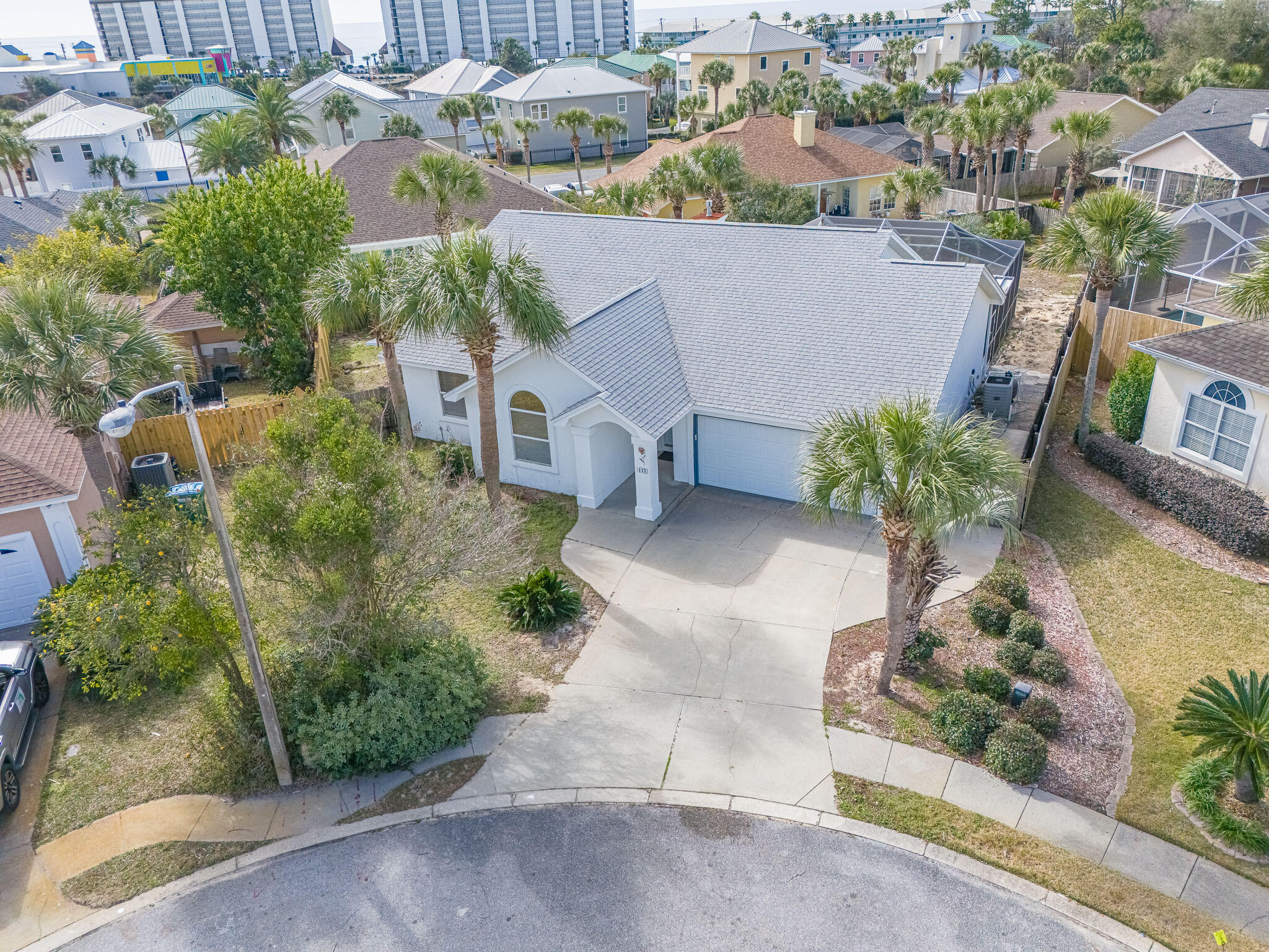 'CURRENTLY UNDER CONTRACT, SELLER WILL CONSIDER BACKUP OFFERS' Just steps from the sugar-white sand and tucked away on a quiet cul-de-sac, this 3-bedroom, 2-bath beach oasis truly has the best of both worlds. Located in the heart of Summer Breeze, one of West Panama City Beach's most loved neighborhoods, this home on Nautical Way offers laid-back coastal living with everyday convenience. You're just a short walk or golf-cart ride to the beach, Pier Park, and local favorites like McGuire's Irish Pub and Topgolf--close to it all, yet perfectly tucked away.
With approximately 1,750 square feet, the home is designed for easy living and effortless entertaining. Out back, a fully renovated in-ground screened pool and large fenced yard create your own private retreatperfect for relaxing after a beach day or hosting friends and family. Inside, you'll

find new LVT flooring, fresh exterior paint (2023), and brand new stainless-steel appliances that give the space a clean, updated feel. Dual kitchen pantries and generous storage make everyday life simple, while the spacious laundry room conveniently connects the garage to the pool deck because beach living should be practical, too.
One of my favorite features of this home is its flexible layout. Originally designed with a private mother-in-law suite, this area includes two guest bedrooms, a full bath, private entrance, screened porch, and side yard. The former kitchenette has been removed, giving future owners endless options use it as a guest retreat, bunk room, media space, home office, extra storage, or easily convert it back into a true suite. The primary bedroom offers two walk-in closets and an en-suite bath with a stall shower, creating a peaceful place to unwind.
Additional highlights include a two-car garage, natural gas hookups for grilling and appliances, and a large screened pool enclosure for year-round enjoyment. Big-ticket updates have already been handled, offering peace of mind with an 18 SEER HVAC system (2016), new roof (2017), and new hot water heater, pool pump, and wood railing upgrades.
Whether you're looking for a full-time home, a beachside escape, or a flexible space that can grow with you, 117 Nautical Way offers coastal living that simply feels right.