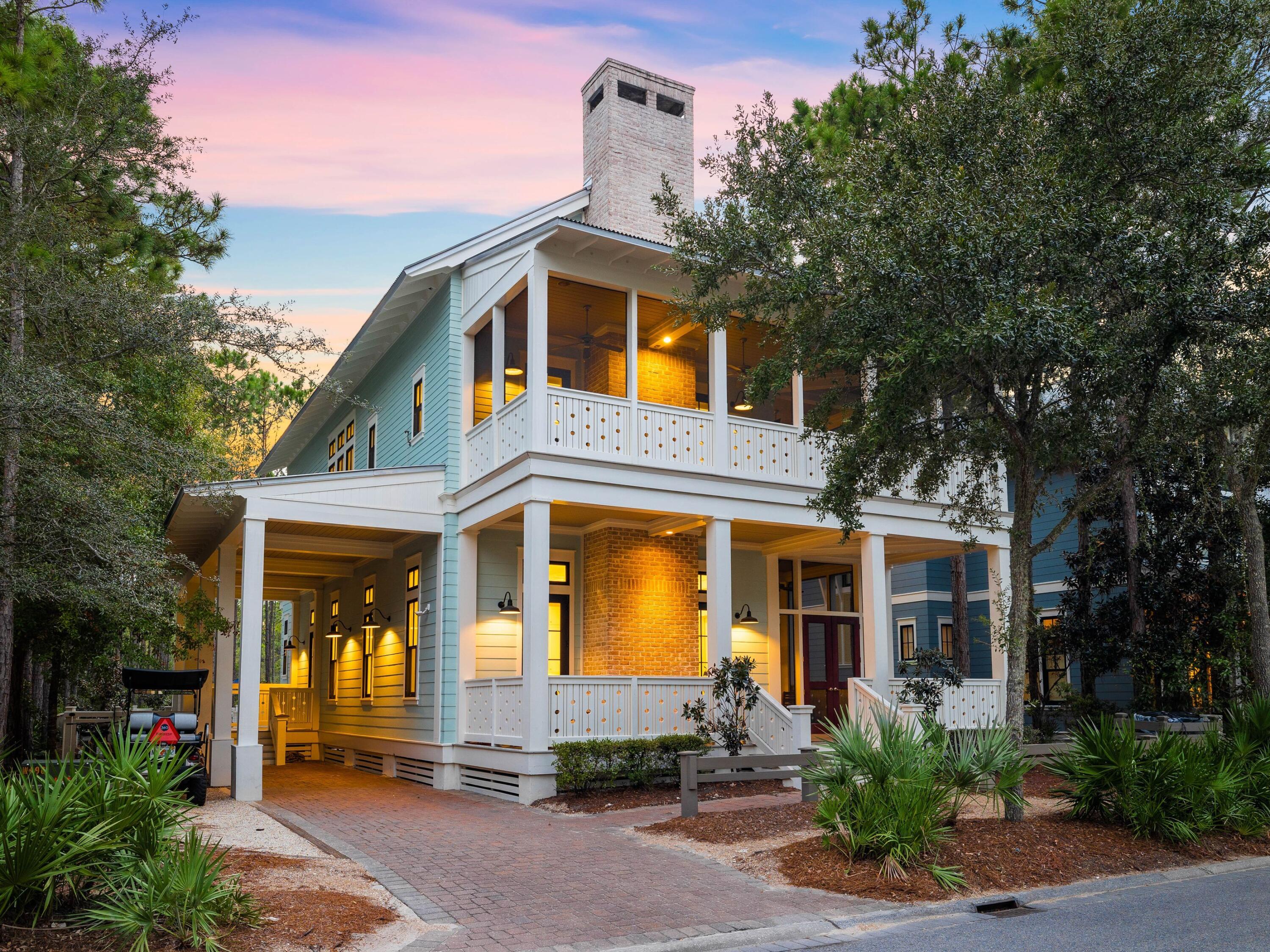 This magnificent five-bedroom beach house provides a luxurious full-time residence or vacation home in WaterColor's lush Forest District. Recent renovations include a new private pool, an extra bath and a remodeled laundry room. This turn-key beach house feels warm and welcoming as soon as you step onto the covered front porch. Beneath a coffered ceiling, the massive great room is a place for family gatherings and memory-making around a feature fireplace. Warm hardwood floors and high-end furnishings ensure guest comfort while dining, socializing and relaxing together. The generous living/dining space flows seamlessly into the gourmet kitchen with an oversized island for savoring snacks and pre-dinner drinks. It's sure to trigger kitchen envy, packed with high-end appliances, beautiful cabinetry and mottled granite countertops. The luxury continues in the first-floor bedroom and ensuite bathroom providing stair-free living if required. On the second floor, there are three further bedrooms including the master and a bunk area. Within the bunk area is a spiral staircase that leads to the third floor bedroom.  It boasts four bunks and a queen bed, sleeping six and an additional bathroom. It's sure to be a hit with young visitors. The master suite is a heavenly escape with beautiful woodwork and sumptuous furnishings. The master bath delivers a spa-like experience with its free-standing tub, lengthy double vanity and generous walk-in shower. The second-floor porch provides a peaceful space for lounging, reading and quiet meditation. Head outdoors through the spacious side porch to the generous paved terrace surrounding the curving pool. Shaded by mature trees, it's a tranquil retreat that lends itself to social gatherings and barbecues. The wider WaterColor community excels with first-class amenities including Camp WaterColor for kids, a Beach Club, parks, boardwalks and a fully stocked boathouse for paddleboarding and kayaking on beautiful Western Lake.