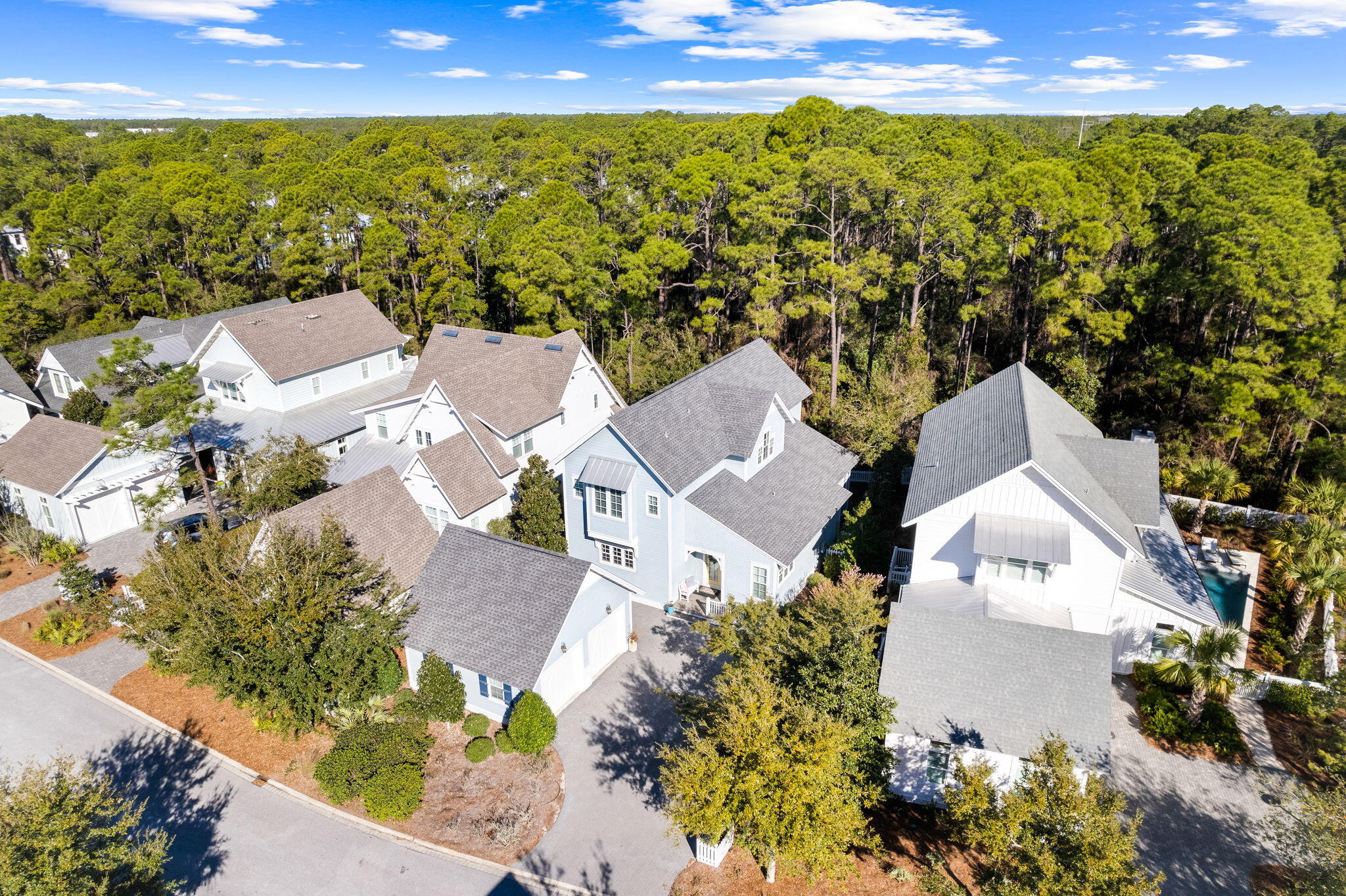 Located in an exclusive gated community,
22 Sextant Lane offers premier access to the lifestyle and amenities of the Watersound West neighborhood. Backing up to the state park, this property provides an unparalleled approach to the natural resources, sugar white
 sands and emerald waters of 30A's coastal beaches. Siituated alongside the state park and boasting a private beach for the neighborhood residents, the access to the emerald waters is one of the most unique on 30A. 


The coastal design features an expansive 
 living space that seamlessly connects the kitchen, dining area, and living room. The Chef's kitchen showcases an oversized island and luxury appliances. Step outside and an outdoor living area highlighted by a relaxing screened-in porch. The primary suite,
 found on the main level, presents an extravagant bathroom adorned with a double vanity, a custom-tiled shower, complete with a walk-in closet. An office or "bunk room" alongside a full
 bath and laundry room completes the main floor. Up the stairs, you will find three additional bedrooms, complete with two full baths as well as an additional sitting area. Hardwood flooring is situated throughout the house which really completes the coastal
 look of the perfect beach home. Watersound West Beach is located in the highly sought after east end of 30A. Amenities include a large resort pool, walking trails and deeded beach access.