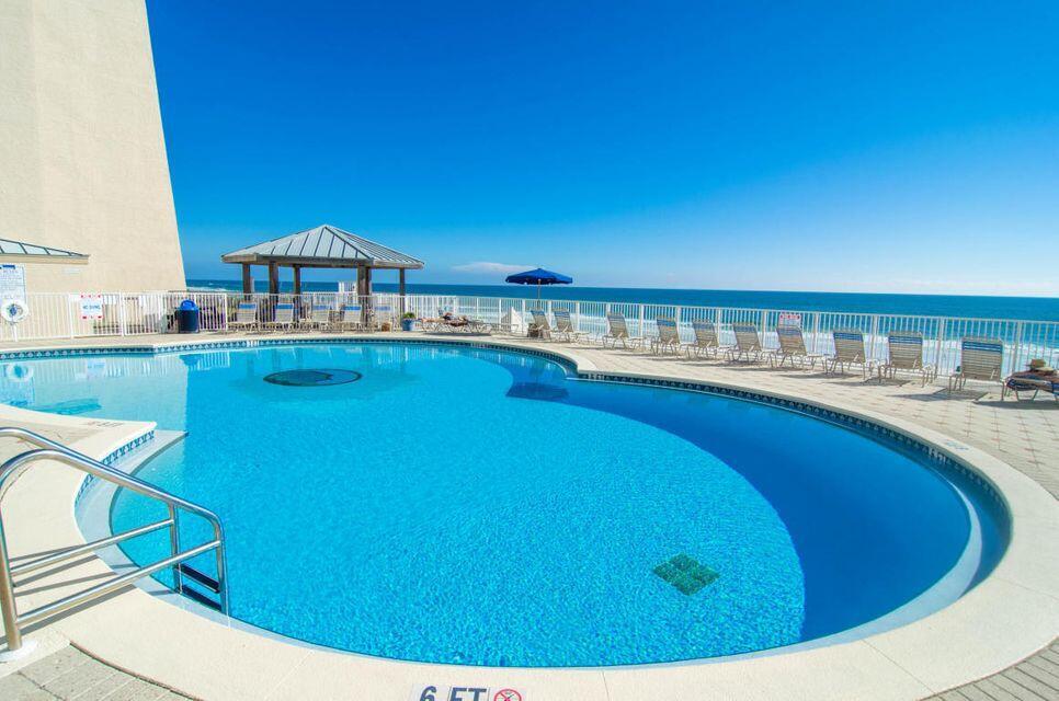This lovely direct beach front condo has a fabulous panoramic
view of the Gulf of Mexico. . Beach House is a low rise community closer to the beach than most other condos in the area and has some of the least crowded beaches around thanks to approximately 600' of private beach with easy access.  The kitchen has updated  cabinetry, granite counters,  and stainless appliances.  The bathrooms have matching granite topped vanities. Located on the popular walking/bike path on Scenic 98. Many fun restaurants and attractions in the area.  Top of the line amenities include easy access to the beach , fitness center, tennis, shuffle board, gulf front pool and hot tub. Plenty of room for the family to make memories and you can also cash in $$$ on short term rentals.