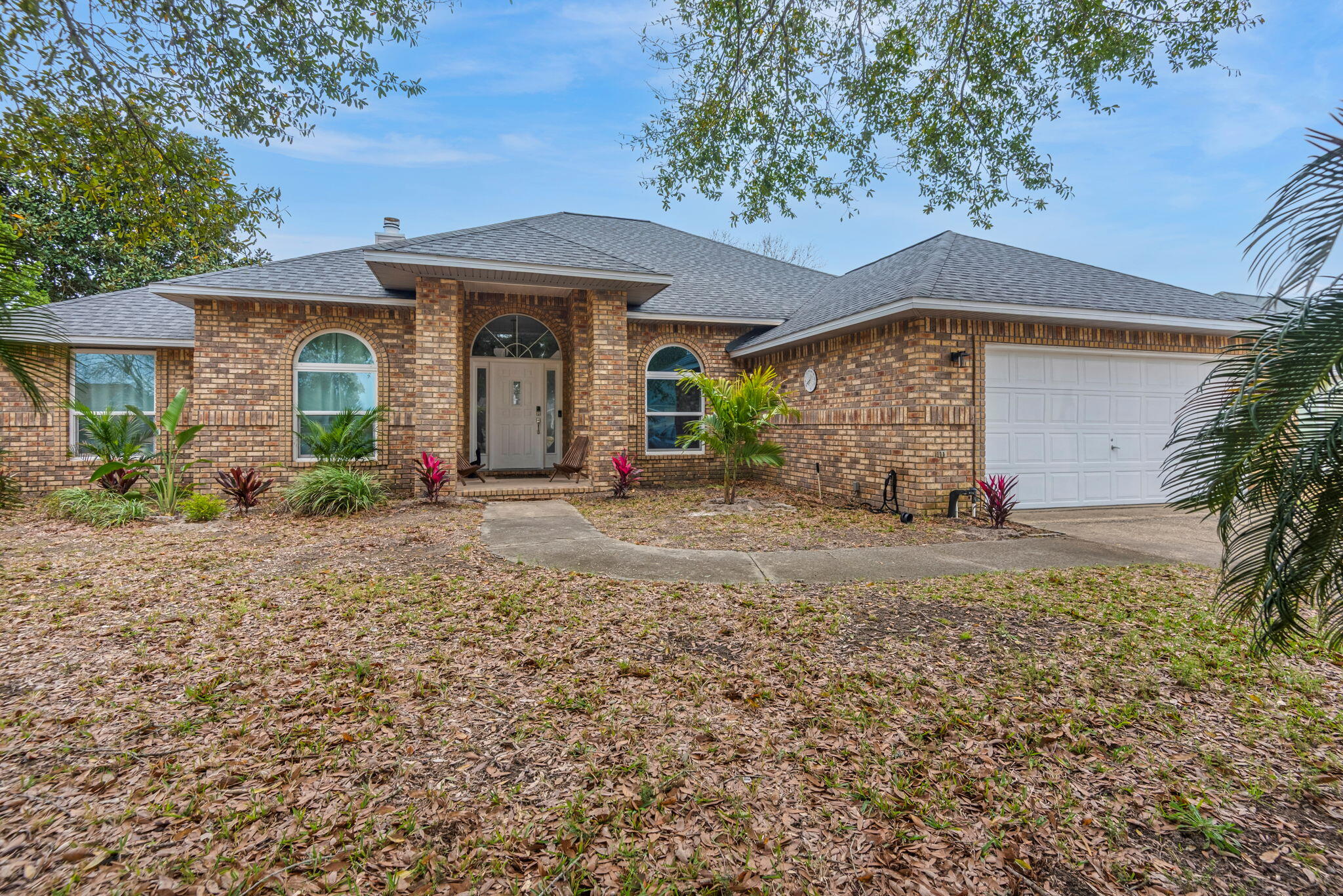Back on Market-no fault of seller. Experience Florida living at its finest in this impeccably renovated all-brick pool residence, gracefully situated within the prestigious Chevalier community. Fully functioning AirBnB with over $55,000 in profit in 2025! Thoughtfully redesigned with luxury flooring, designer lighting, stainless appliances, fresh interior finishes, and elegant linen drapery throughout, this home blends timeless style with modern comfort.

The open, light-filled floor plan showcases soaring ceilings, multiple skylights, and a striking fireplace that anchors the main living space. The beautifully renovated kitchen offers abundant cabinetry and expansive counter space, ideal for both everyday living and entertaining. The spacious primary suite accommodates oversized furnishings and features a spa-inspired bath complete with an oversized tiled shower and jetted tub. A split-bedroom layout ensures privacy, with generously sized secondary bedrooms and a well-appointed Jack and Jill bath.

A climate-controlled sunroom adding substantial additional usable space provides endless versatility for a second living area, executive office, or recreation room. Outdoors, enjoy a sparkling inground pool, resurfaced deck, and a fully fenced private yard with irrigation system and storage shed. Recent upgrades include a 2020 roof, 2019 HVAC, hurricane-resistant windows, and updated electrical. Ideally located just minutes from Pensacola's renowned white-sand beaches and exceptional dining.