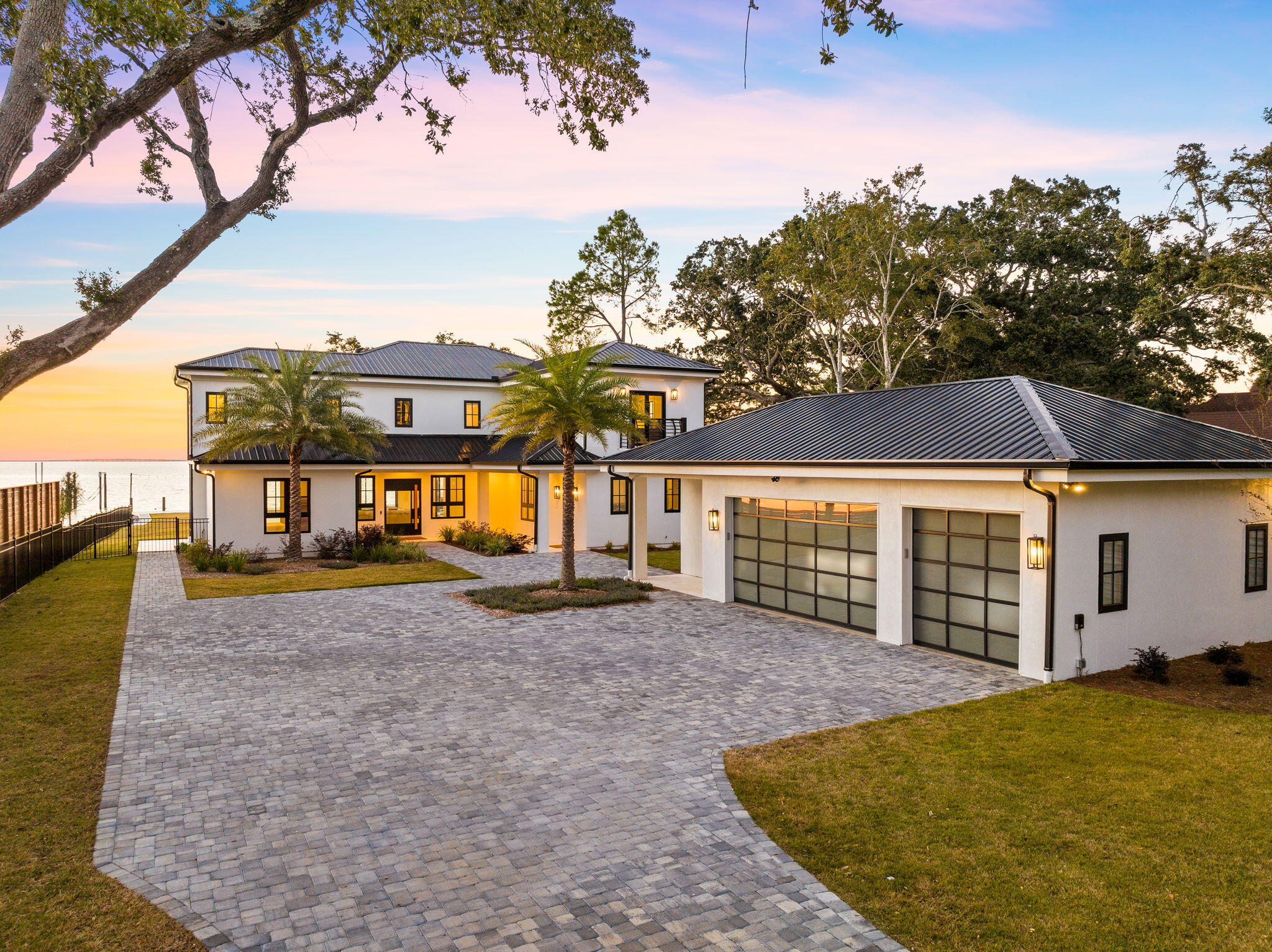 Welcome to 253 Driftwood Point Drive,  a one of a kind bayfront estate offering unparalleled views and world-class sunsets across Choctawhatchee Bay.

Set on an oversized, nearly one-acre homesite, this western-facing property is perfectly positioned to capture breathtaking panoramic vistas and vibrant evening skies year-round. As you approach the residence down a serene, tree lined 300-foot drive, you're immediately struck by the property's presence and privacy. A striking pivot-style front door opens to reveal a completely reimagined interior where water views take center stage from nearly every room.

This thoughtfully redesigned 4 bedroom, 5  bathroom home has been taken down to the studs and rebuilt with today's modern standards in mind  combining timeless elegance with the convenience of new construction. No detail was overlooked: new roofing, windows, doors, insulation, siding, mechanicals, flooring, lighting, tile, and more. The resort-style pool and spa add a luxurious focal point to the waterfront backyard, which boasts over 115 feet of pristine bay frontage.

Out back, a newly built 900-square-foot composite dock invites you to fish, relax, or watch dolphins at play, it is a true waterfront lifestyle experience.

The oversized detached 3 car garage is pre-plumbed and recently finished, with a deep 400-foot irrigation well keeping the landscaping vibrant.

Nestled in the peaceful Driftwood Estates neighborhood, you're only minutes from Sacred Heart Hospital, Grand Boulevard's upscale shopping and dining, and the sugar-white sands of the Gulf.

This is more than just a home. It's an opportunity to live a coastal lifestyle with comfort, space, and spectacular views.