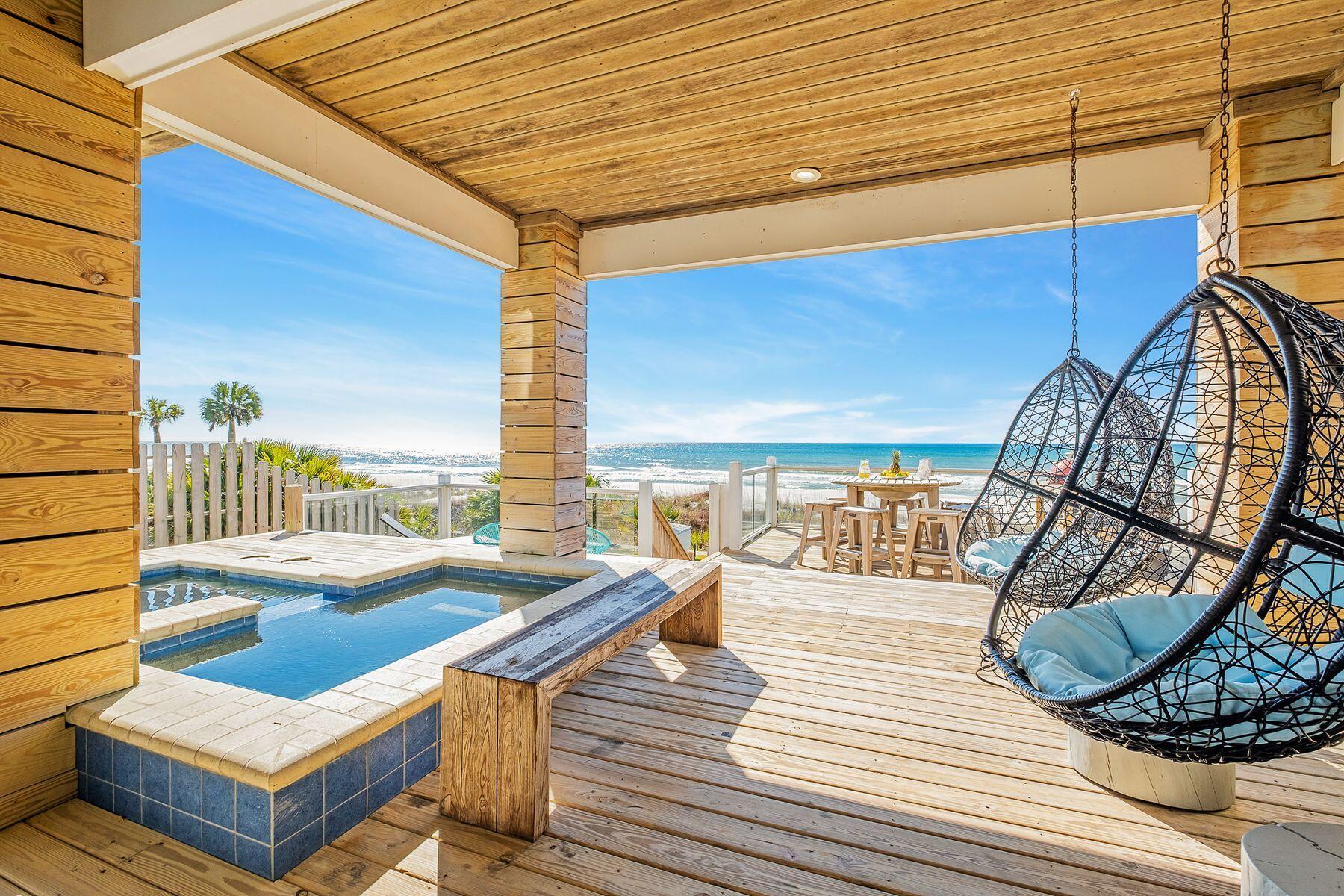 Few beach houses can outshine this amazing gulf-front home on Panama City Beach. Three stories of bright living space include two magnificent gulf-front master suites with balcony access, a fitted bunk room for four, a games room and covered terraces on every level. The ground floor includes a garage and huge wooden deck for enjoying uninterrupted views of the white sand and sparkling gulf waters. It's a place for sunbathing, alfresco dining, entertaining and sharing quality time together. Wooden steps provide access to the sand for tranquil morning walks with the pelicans, swimming and shelling. Return and cool off with a dip in the private heated pool and spa before snoozing in the swing chair. The property is eloquently designed with a series of features that reinforce the unspoiled beachfront location. Wood accent walls, beamed ceilings, custom tiled showers and deep soaker tubs provide a sense of luxury with a laid-back ambiance. The Arctic white kitchen combines modern elegance with practicality with a full range of stainless steel appliances. The wood-effect floor tiles flow through the spacious sitting area to a wall of windows. Sliding doors, provide access to the shady porch and stunning views of blue gulf waters to the horizon. There's ample space for dining beneath the coffered ceiling with feature lighting or gather around the lengthy granite breakfast bar to share a feast of seafood, hors d'oevres, sparkling wine and cocktails. The second kitchenette is well equipped for preparing snacks, drinks and fruit platters. It opens onto a hangout spot and games room with a billiard table and foosball. Deep, cushioned armchairs invite you to chill out with a beer and good friends. This breathtaking residence is for sale turnkey as a lucrative investment with high rental potential. Life's a beach, as they say.